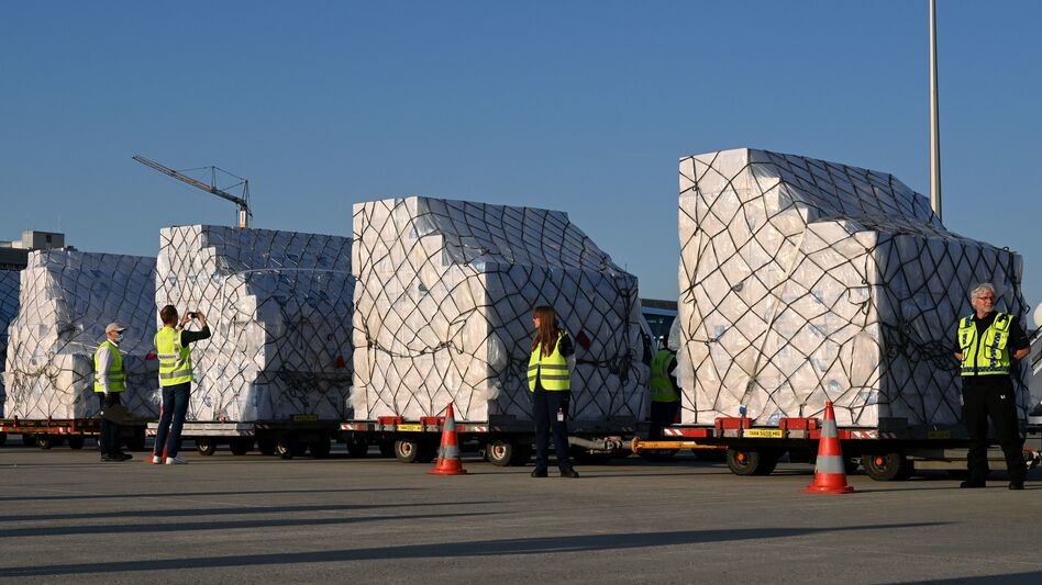 Batches of 8 million protective masks are unloaded from a Lufthansa airplane at the Franz Josef Strauss airport in Munich on Tuesday after arriving from Shanghai. (Christof Stache/AFP via Getty Images)
