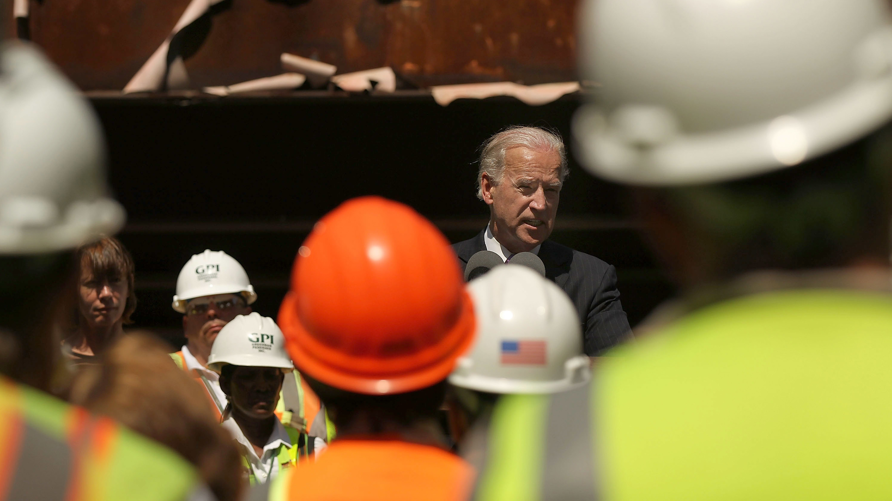 In 2010, Vice President Joe Biden speaks to construction workers at the Brooklyn Bridge, marking a renovation project which was partly funded by money from the 2009 Recovery Act. (Getty Images)