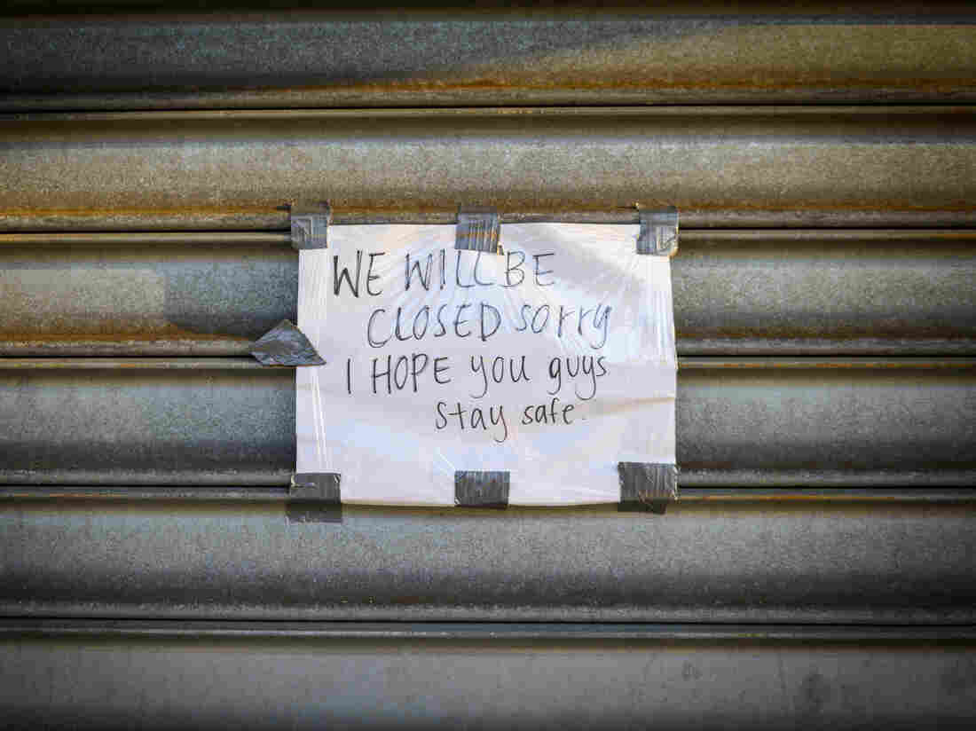 A sign reads "We Will Be Closed. Sorry. I Hope you guys stay safe" outside a store on Metropolitan Avenue in the Queens borough of New York, U.S., on Tuesday, April 7, 2020. Photographer: Christopher Occhicone/Bloomberg via Getty Images
