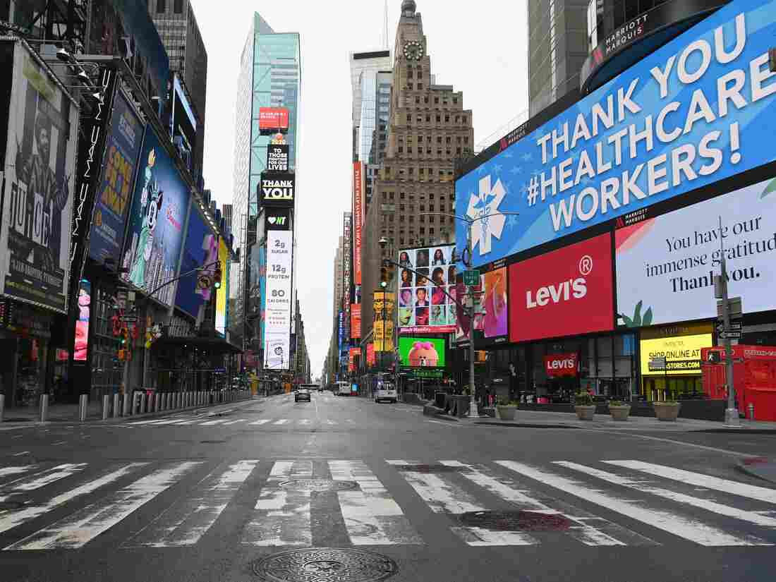 View of an almost empty Time Square on April 03, 2020 in New York. - In New York, the epicenter of the US outbreak, Mayor Bill de Blasio urged residents to cover their faces when outside and Vice President Mike Pence said there would be a recommendation on the use of masks by the general public in the next few days. (Photo by Angela Weiss / AFP) (Photo by ANGELA WEISS/AFP via Getty Images)