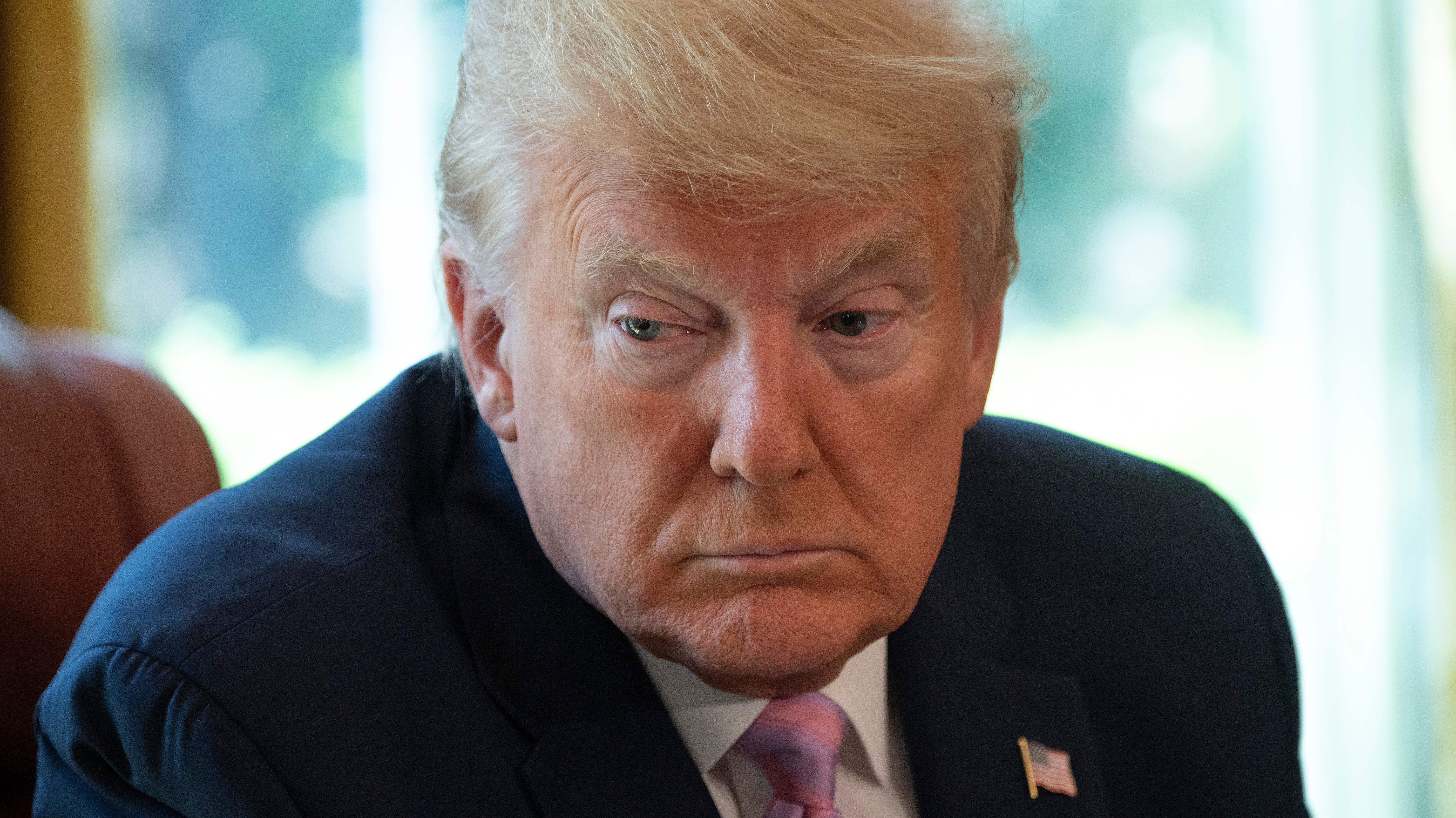 President Trump, pictured during an Easter blessing in the Oval Office on Friday, is set to announce a new advisory council to help him decide when and how to reopen the country for business.