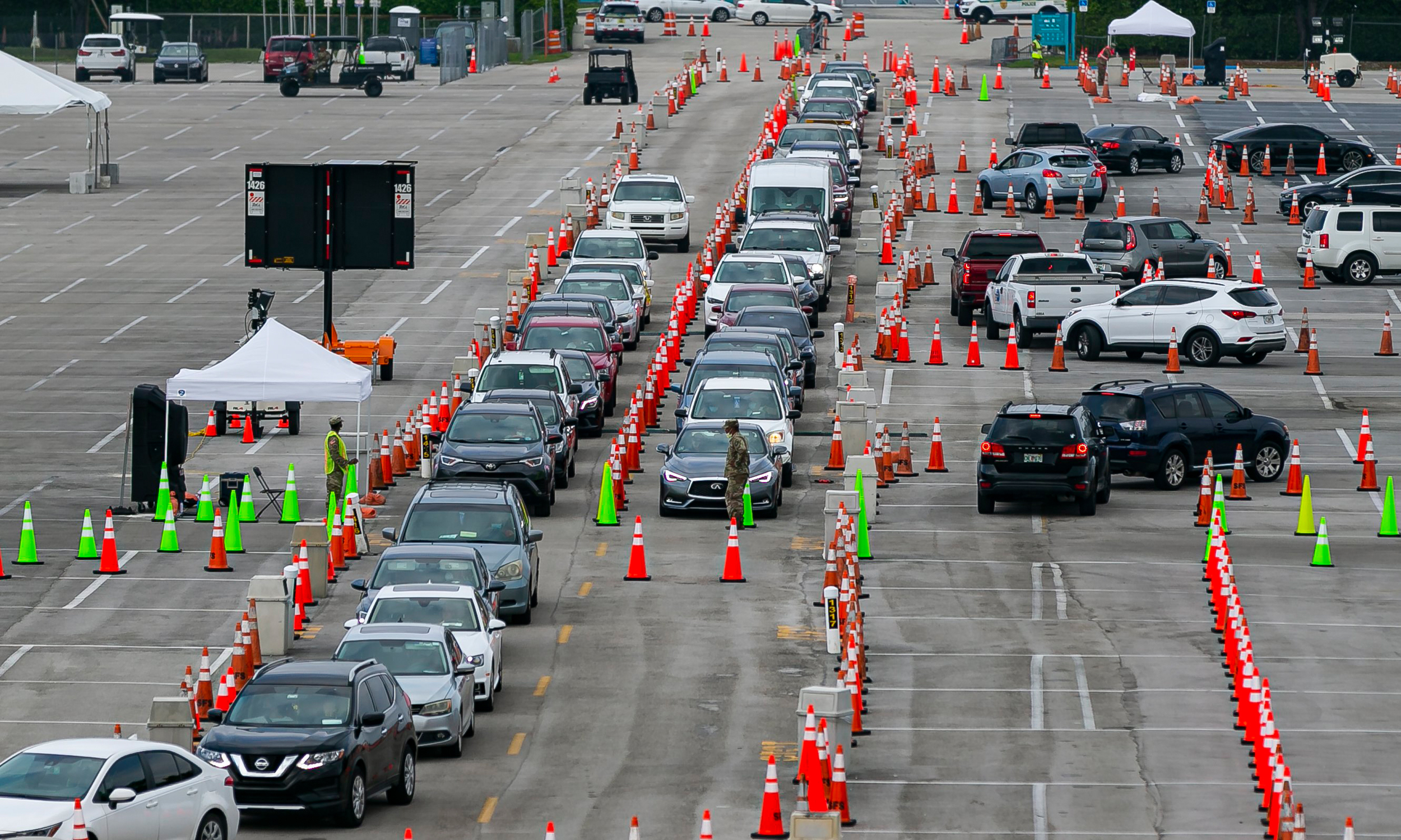 Is the U.S. getting close to being able to reopen, after weeks of social distancing? Experts say more work needs to be done ramping up systems like drive-through COVID-19 testing centers. (Miami Herald/Tribune News Service via Getty Images)