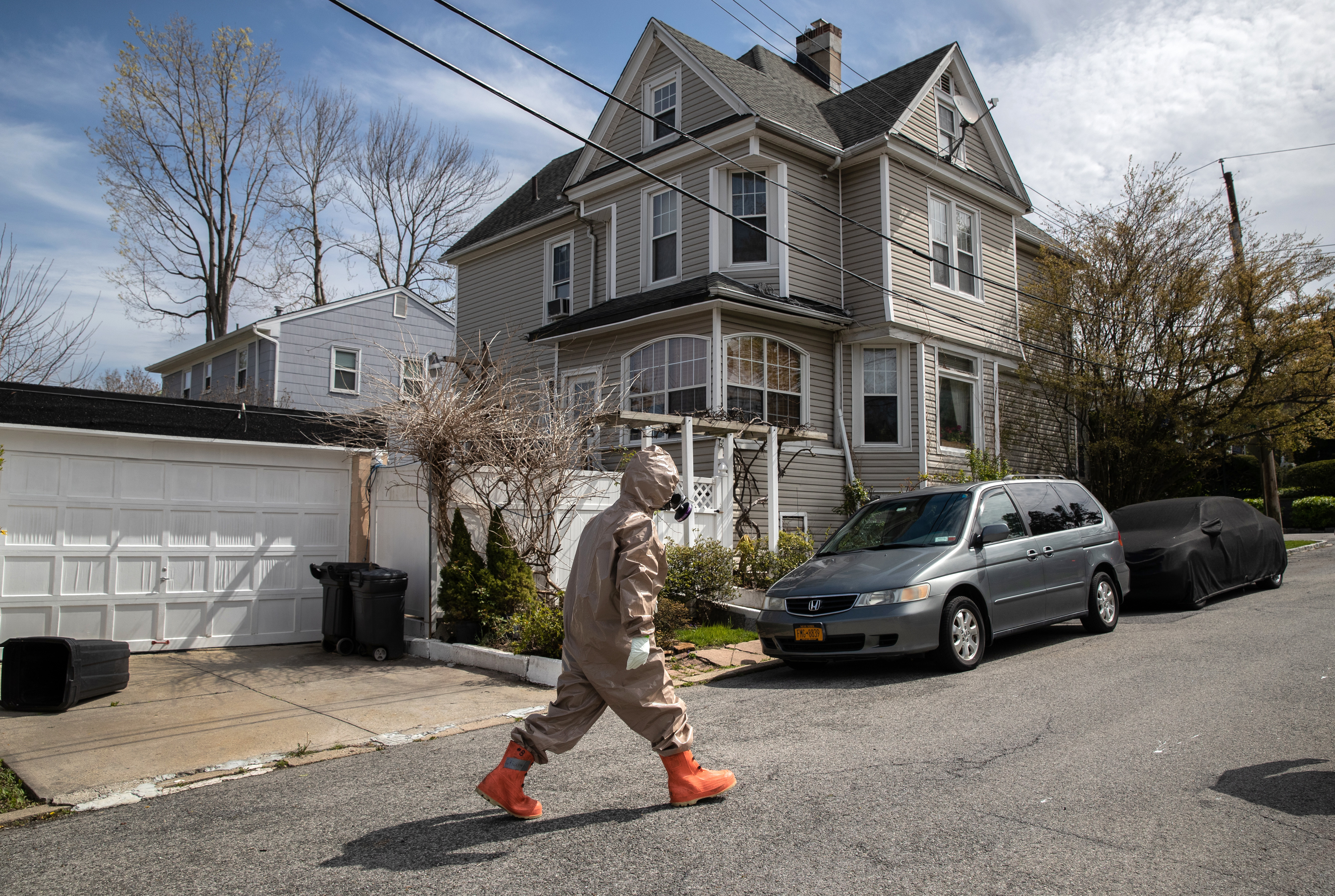 A Yonkers Fire Department EMT wears full personal protective equipment during the coronavirus shutdown in Westchester County, New York. County leaders across the country say they need help paying for essential services as the shutdown continues. (John Moore / Getty Images)