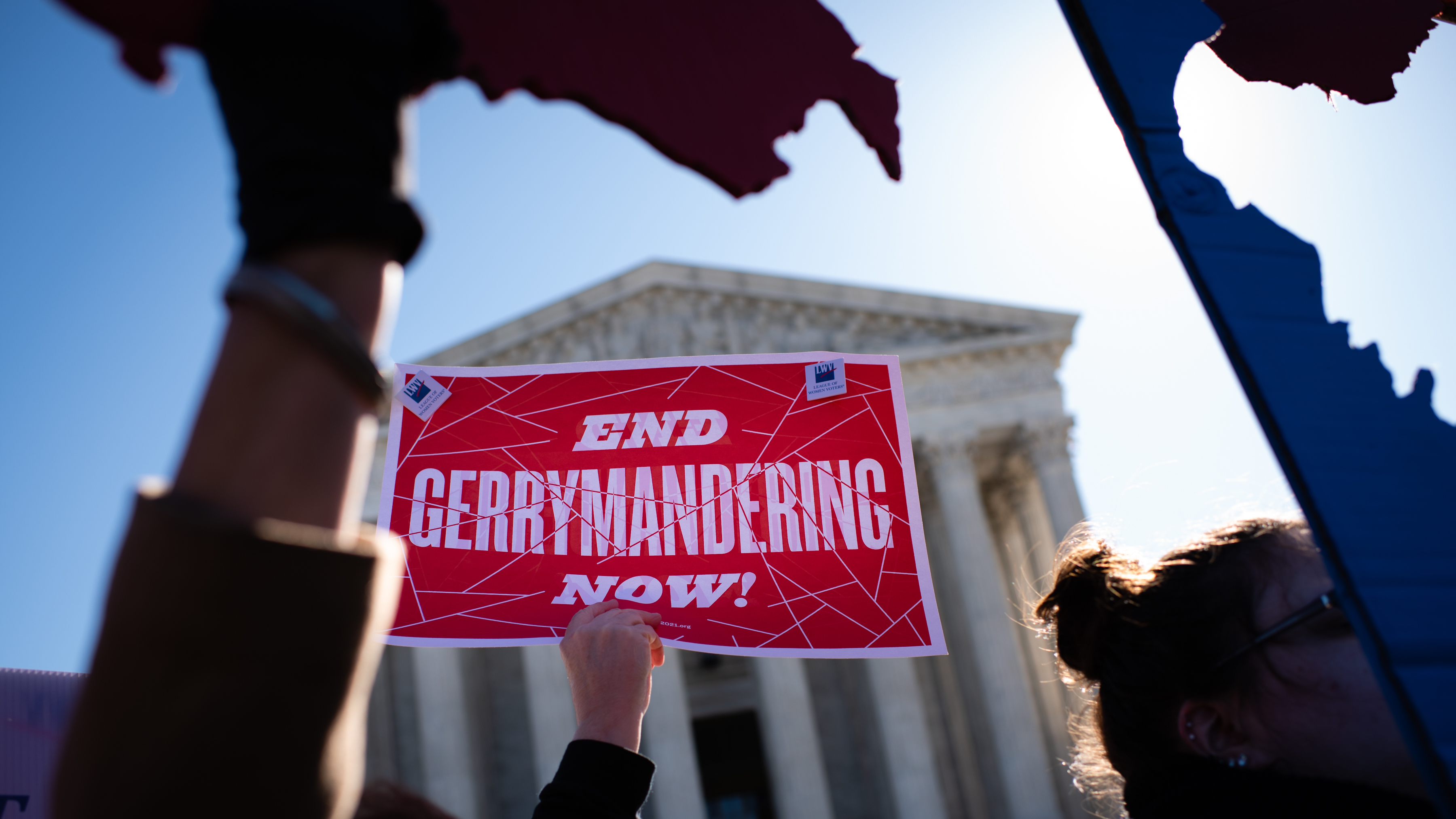 An activist holds a sign outside the U.S. Supreme Court in 2019. (The Washington Post via Getty Images)