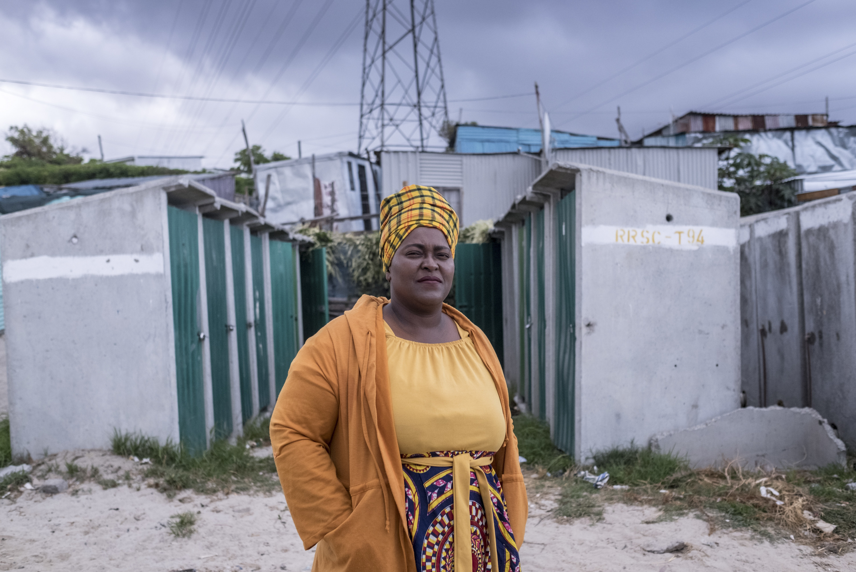 PHOTOS: Lockdown In The World's Most Unequal Country 3 Zukwisa Qeso, who works for the Social Justice Coalition and is the head of her street committee, photographed near her home in the township of Khayelitsha, Cape Town, where she helps raise awareness about COVID-19.