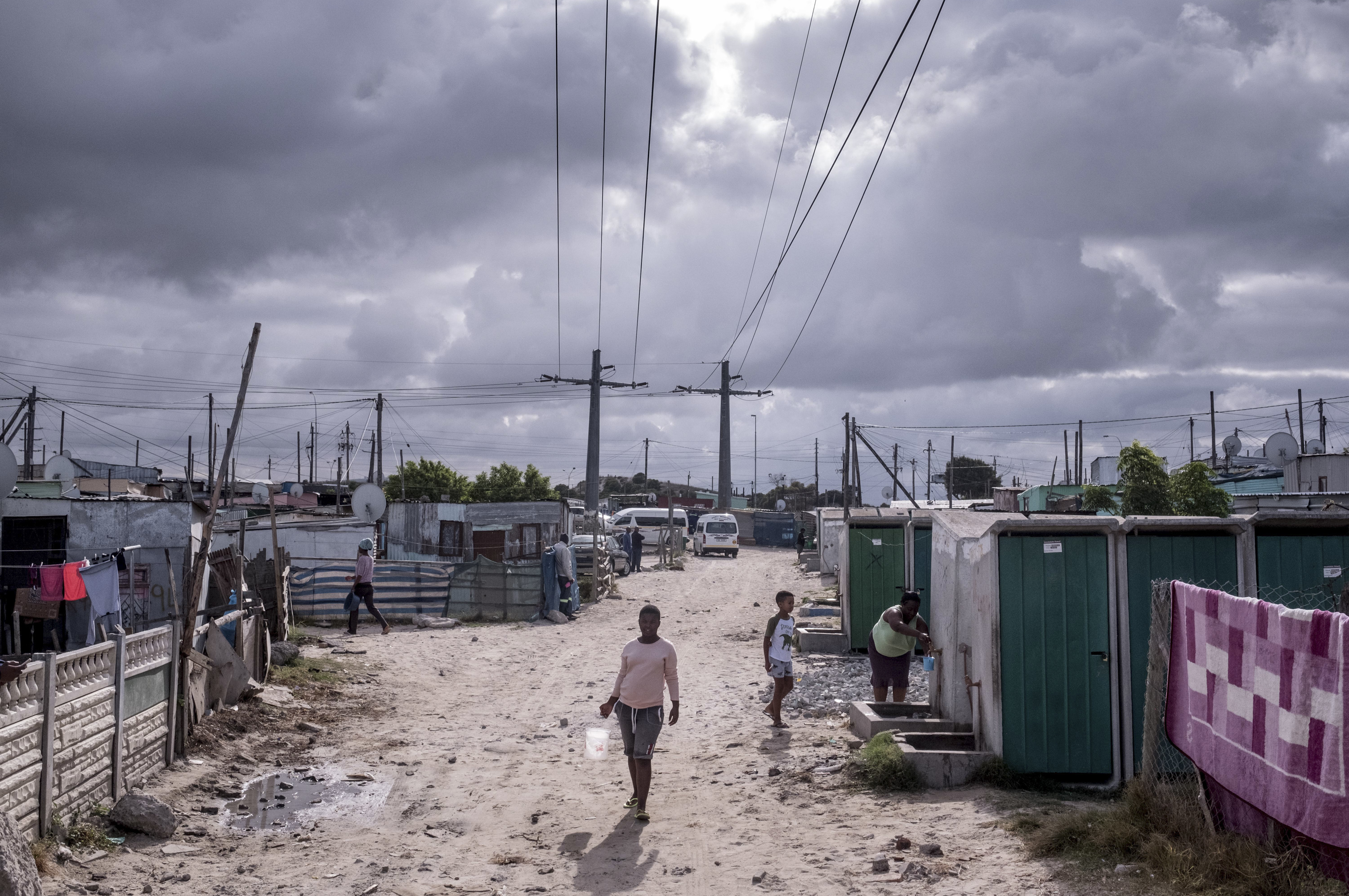 PHOTOS: Lockdown In The World's Most Unequal Country 2 Residents of the township of Khayelitsha visit a communal water tap on day nine of South Africa's coronavirus lockdown.