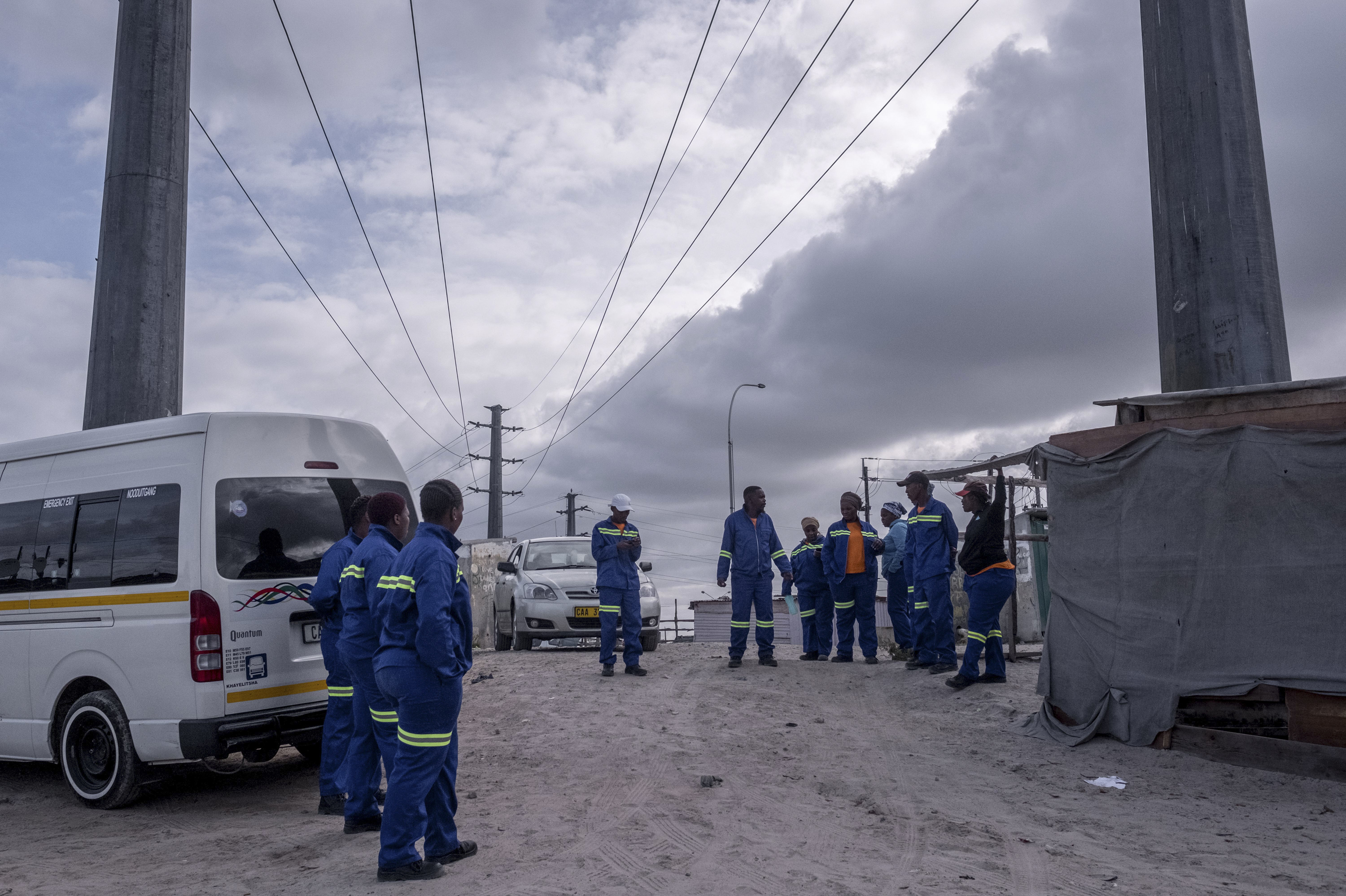 PHOTOS: Lockdown In The World's Most Unequal Country 6 A group of janitors, standing in a parking lot, say they lack the cleaning products needed to take care of communal toilets in the township of Khayelitsha. Each public toilet is used by dozens of people every day.