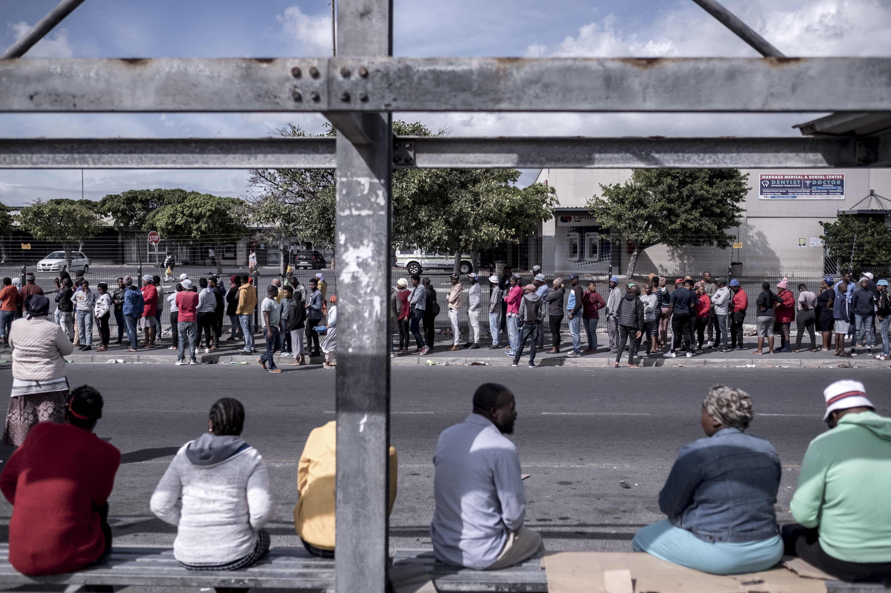 PHOTOS: Lockdown In The World's Most Unequal Country 7 Shoppers line up outside a supermarket in the township of Khayelitsha. On day nine of the lockdown, there was a two-hour wait to get into the store.