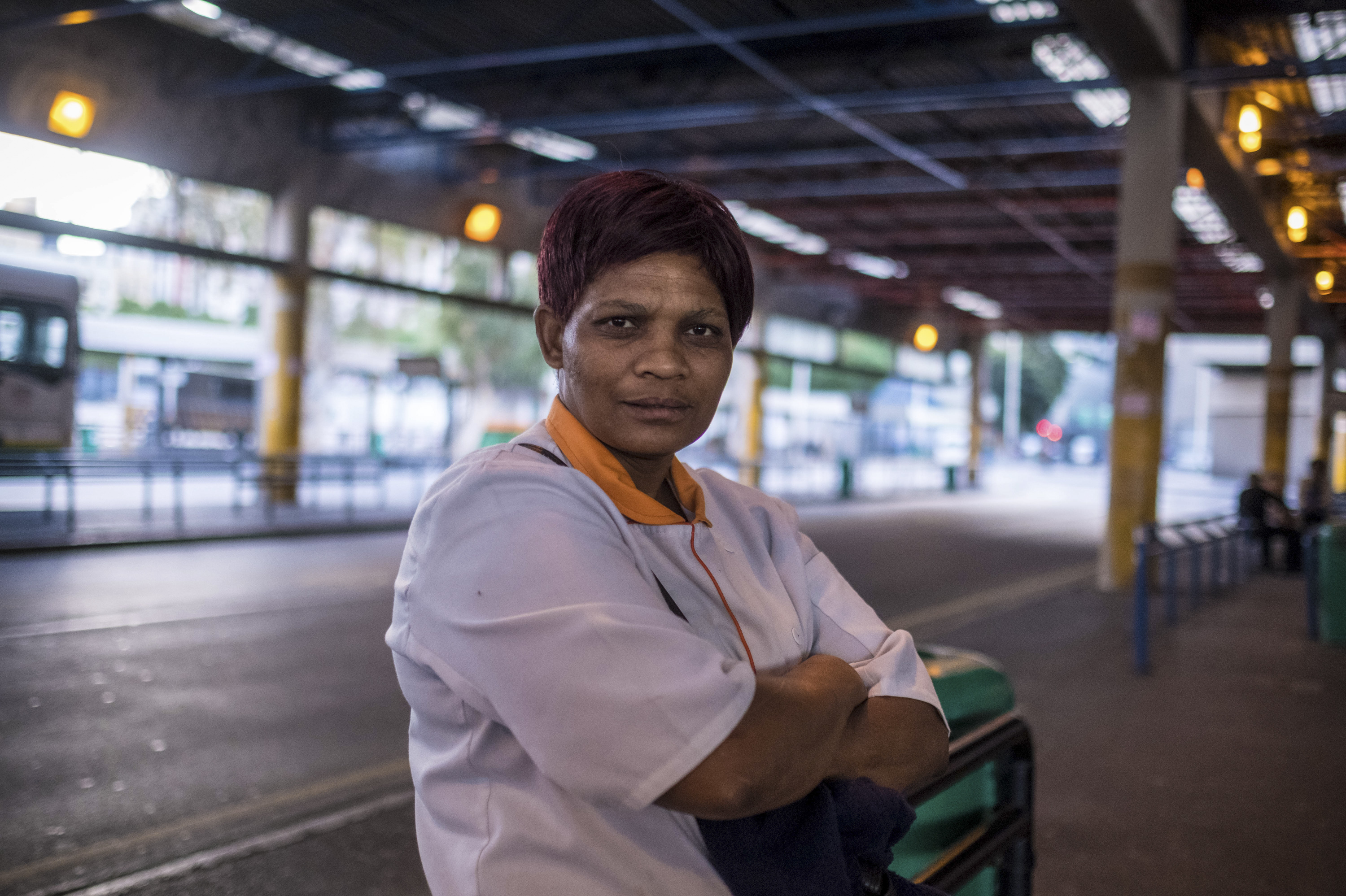 PHOTOS: Lockdown In The World's Most Unequal Country 8 Anna Simpson, 41, who works in the kitchen of a Cape Town hospital, waits for a bus to take her home to the community called Lost City, where she lives with her husband. Many workers who keep crucial industries running live in townships and rely on public transport to get to work — putting them at risk of exposure to COVID-19.