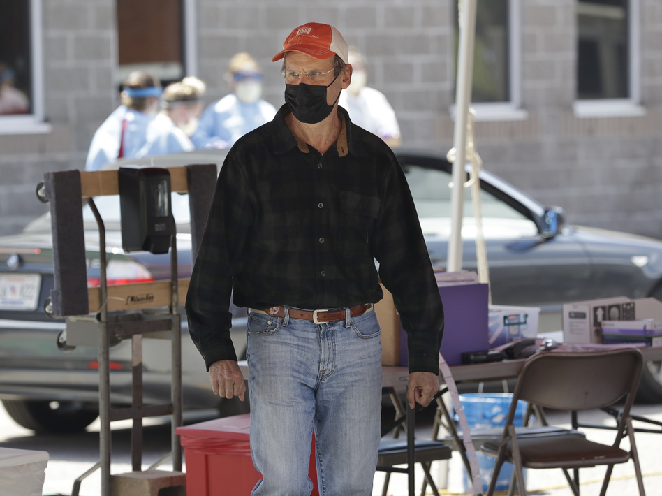 Tennessee Gov. Bill Lee visits a drive-through COVID-19 testing location on April 18 in Franklin, Tenn. (Mark Humphrey/AP)