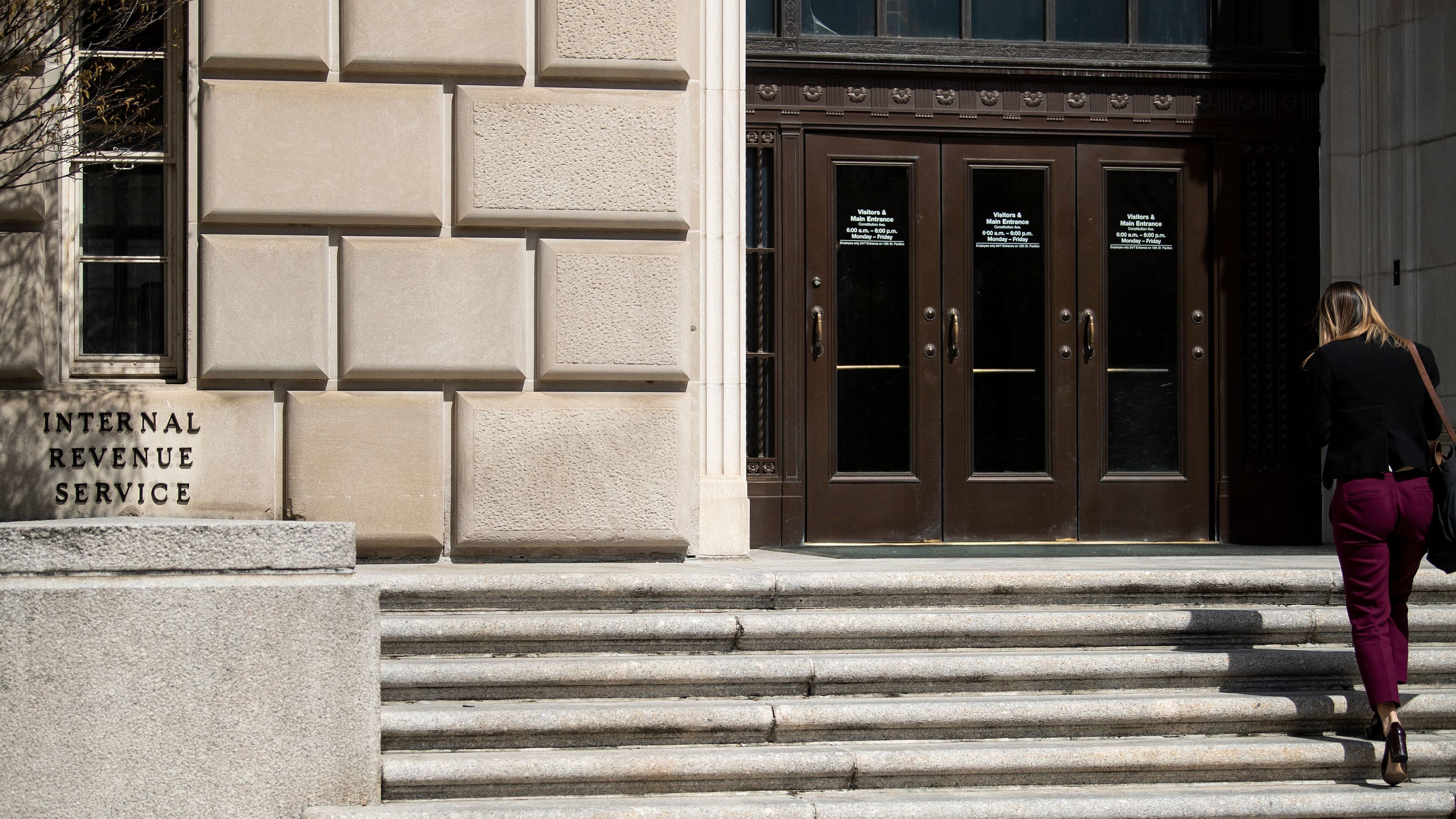 The IRS is calling back thousands of workers but says they must provide their own face coverings because the agency has not yet secured enough personal protective equipment. (AFP via Getty Images)