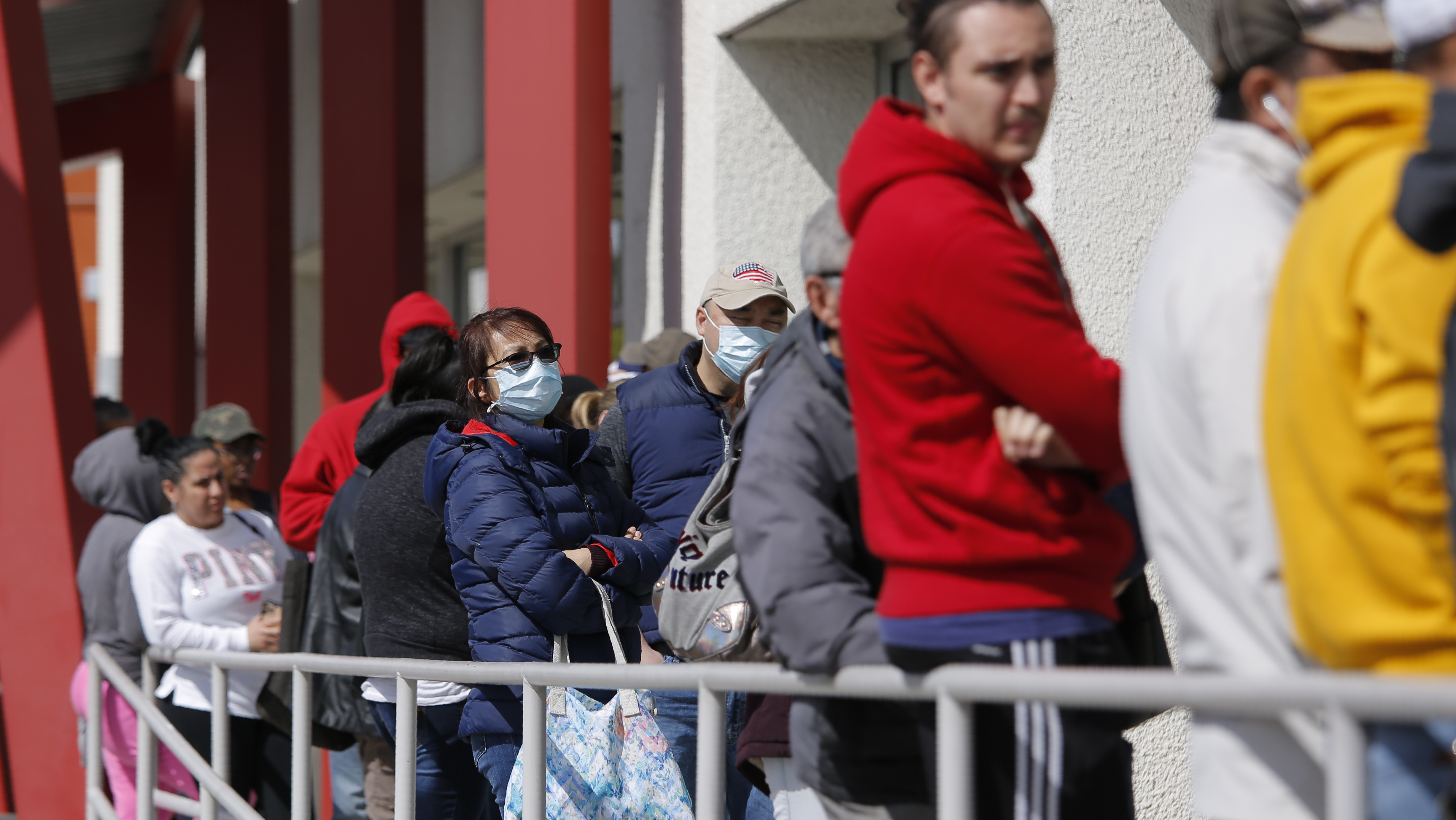 People wait in line for help with unemployment benefits at the One-Stop Career Center in Las Vegas.