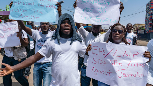 Journalists protest against what they say has been a pattern of using excessive force against them by the police and members of the government