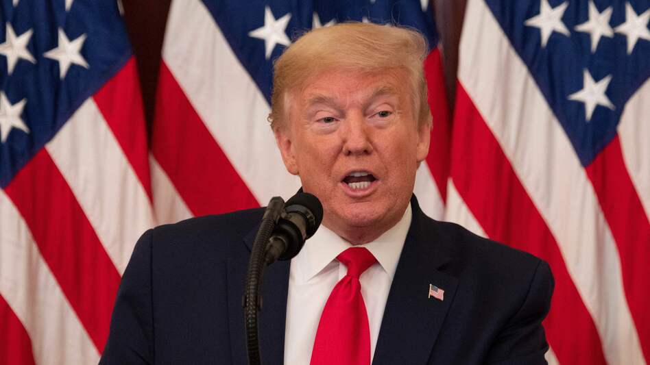 President Trump speaks at the White House on Friday. He is replacing an official who issued a report that found testing delays and equipment shortages at hospitals. (Jim Watson/AFP via Getty Images)