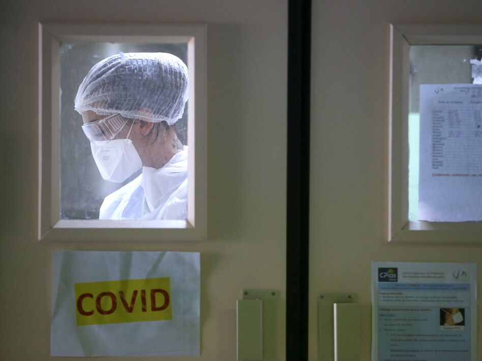 A nurse in the Eugenie Hospital in Ajaccio, on the French Mediterranean island of Corsica, on April 23. France appears to have had its first case of COVID-19 in December, a month earlier than doctors thought. (Pascal Pochard-Casabianca/AFP via Getty Images)