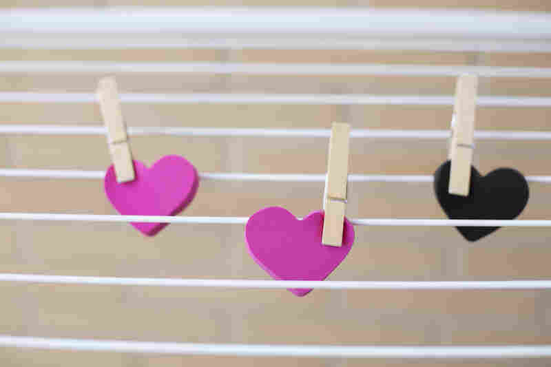 three hearts held on clothes pins