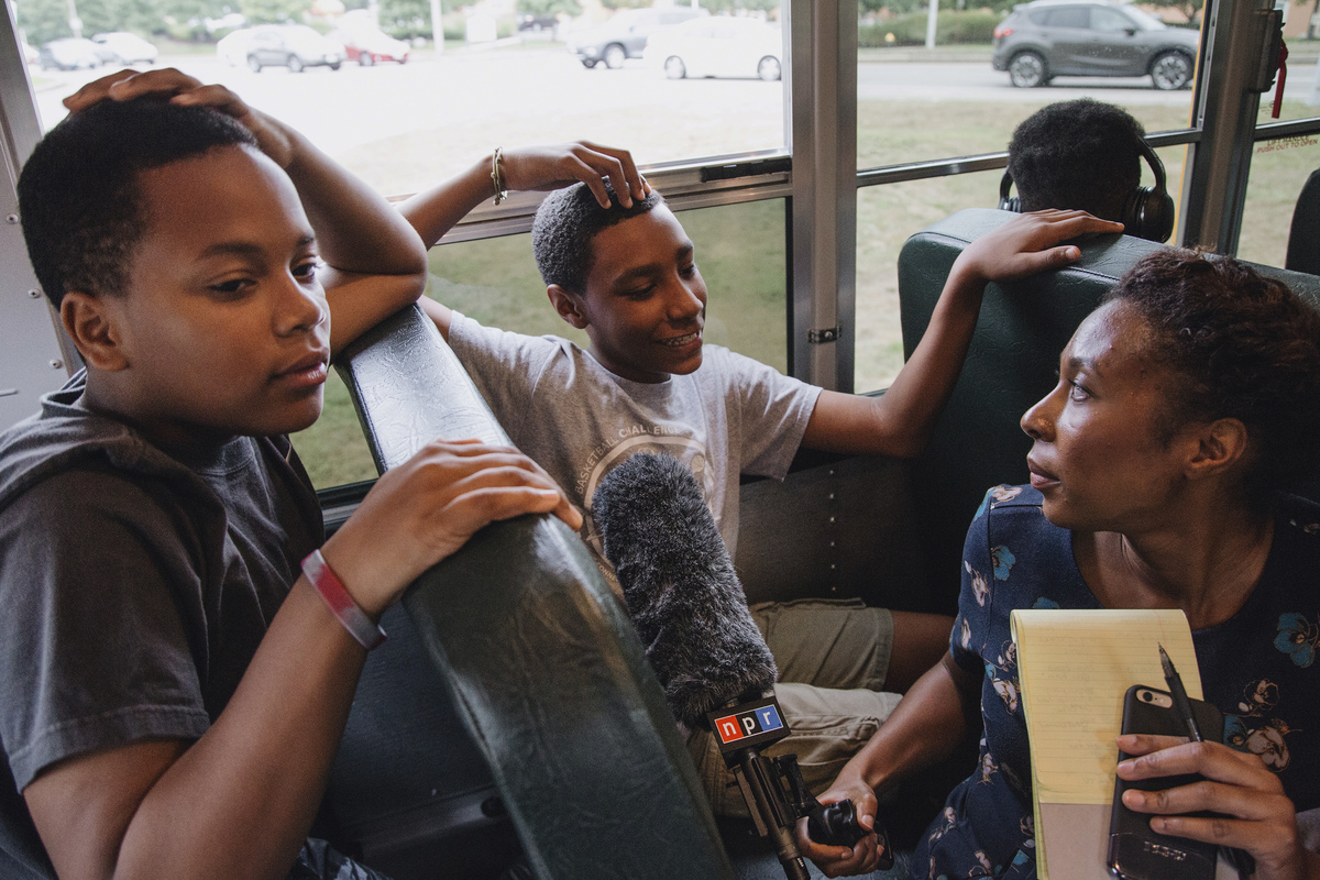 Audie Cornish, who was a part of the METCO program when she was a kid, interviews Bryan Bailey and Robert Figueroa as they ride the bus