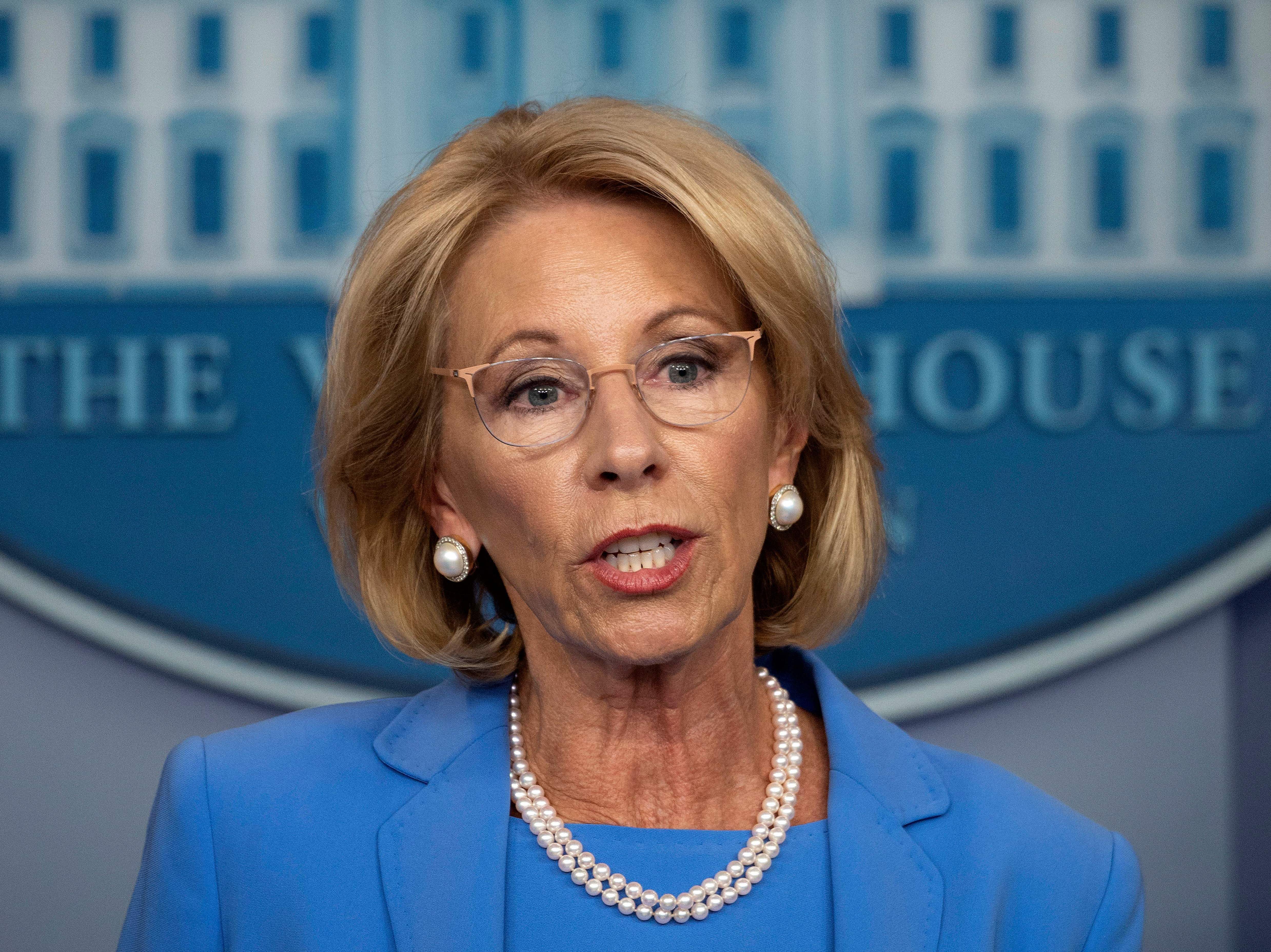 Education Secretary Betsy Devos, seen on March 27, has released new rules for sexual assault complaints on college campuses. (AFP via Getty Images)