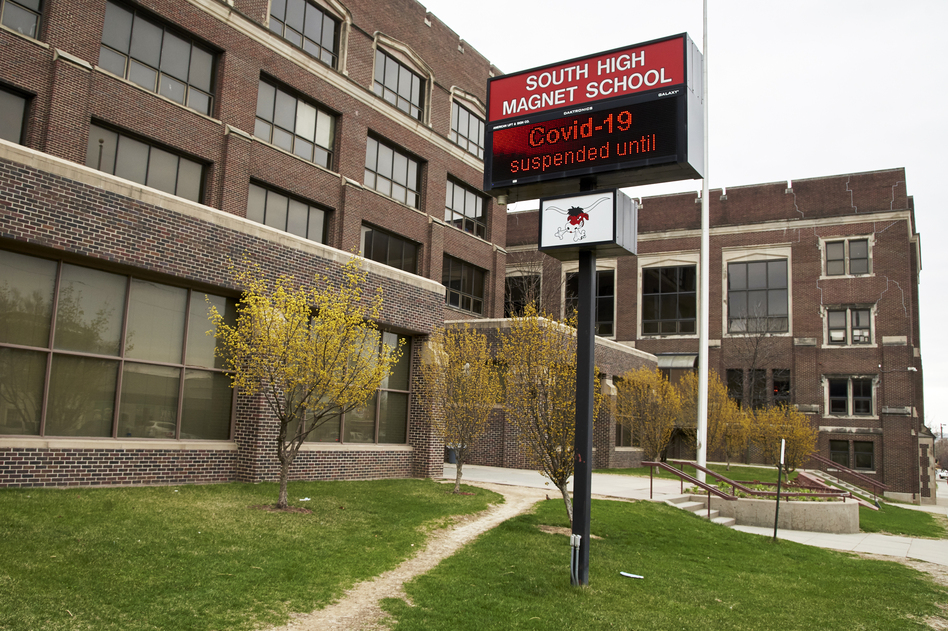 An electronic sign at South High Magnet School in Omaha, Neb., announced on April 2, that school is suspended until further notice, due to the coronavirus. (Nati Harnik/AP)