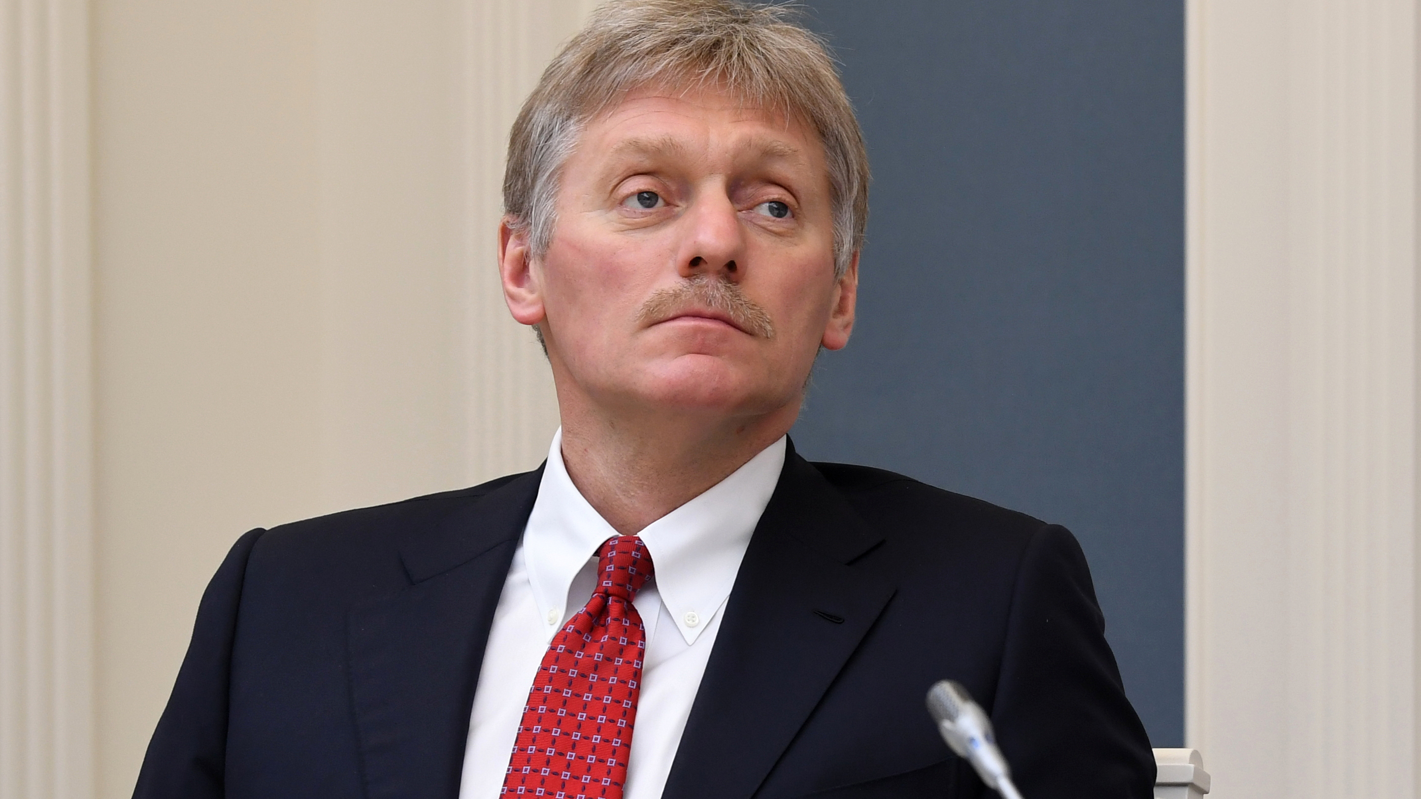 Kremlin spokesman Dmitry Peskov says he is currently hospitalized with COVID-19 — a revelation that came as Russia hopes to emerge from a shutdown despite a spike in new cases. Peskov is seen here during a video conference with Russian President Vladimir Putin in Moscow on April 14.