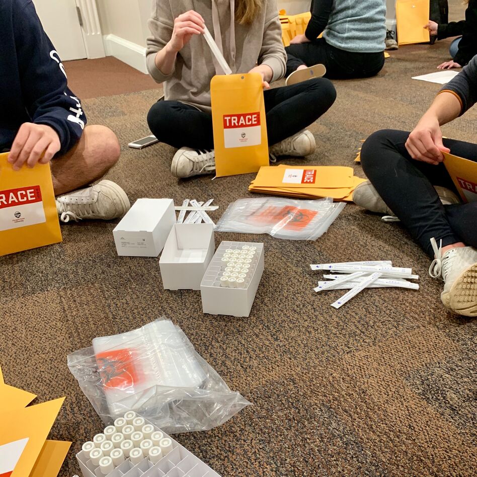TRACE field staff assemble nasal swabs, collection tubes and other materials into home sampling kits. All field staff are tested for COVID-19 each week prior to working. (Laura de la Torre/Oregon State University)