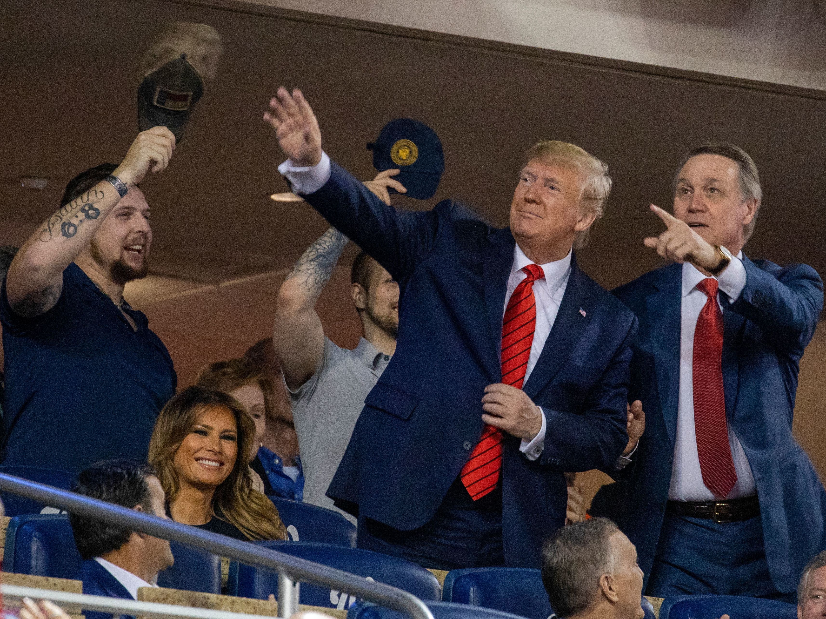 President Trump stands during Game 5 of the World Series at Nationals Park in Washington, D.C., last October. (AFP via Getty Images)