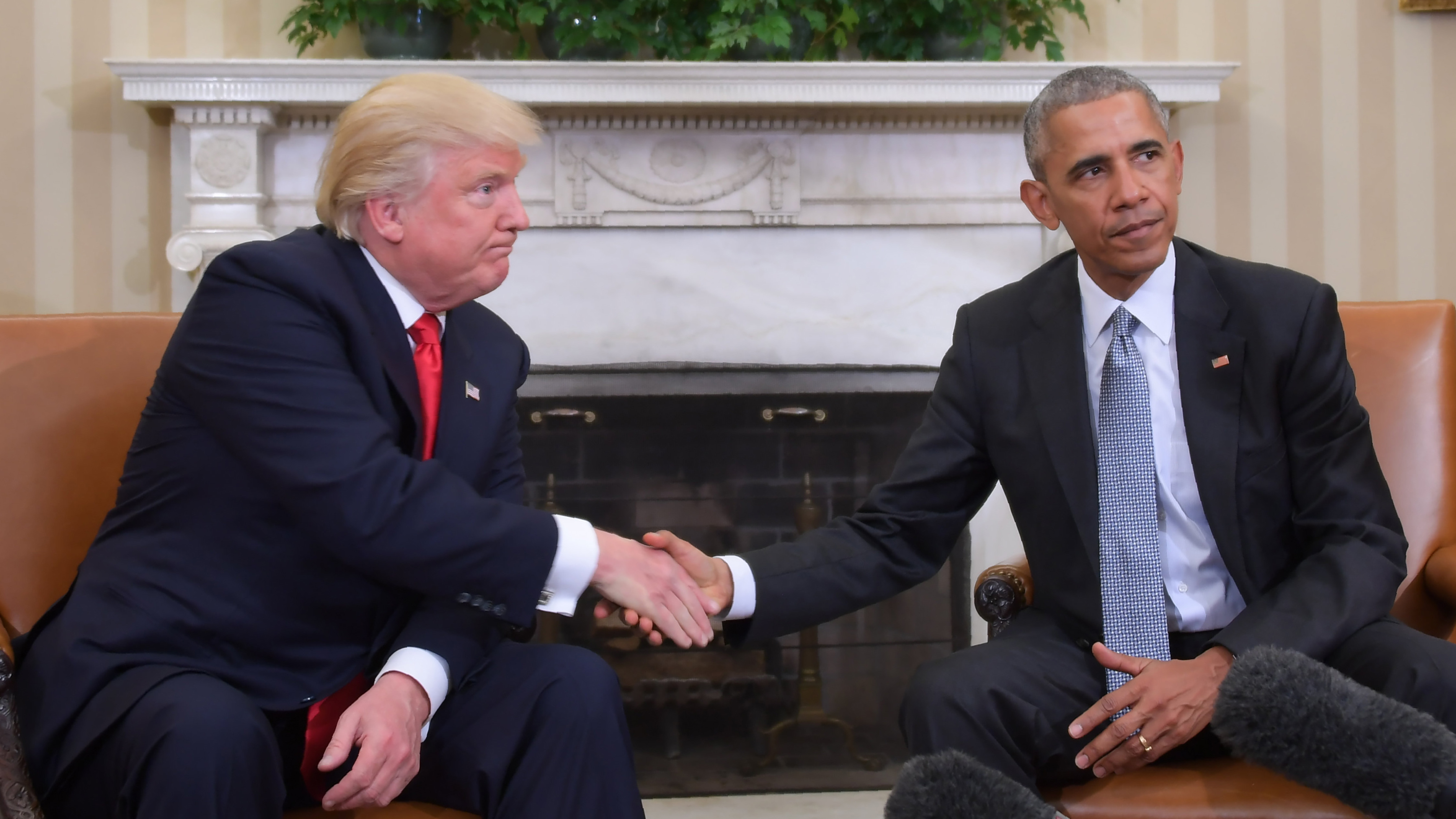 Then-President Obama and then-President-elect Donald Trump shake hands during a transition planning meeting in the Oval Office at the White House in November of 2016.