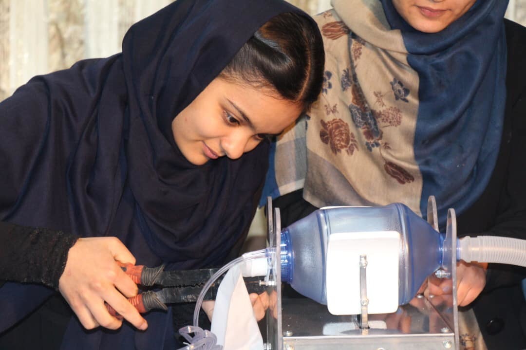 Elham Mansoori, member of Afghan Dreamers, an all-girls robotics team in Afghanistan, works on their prototype of a ventilator. (The Digital Citizen Fund)