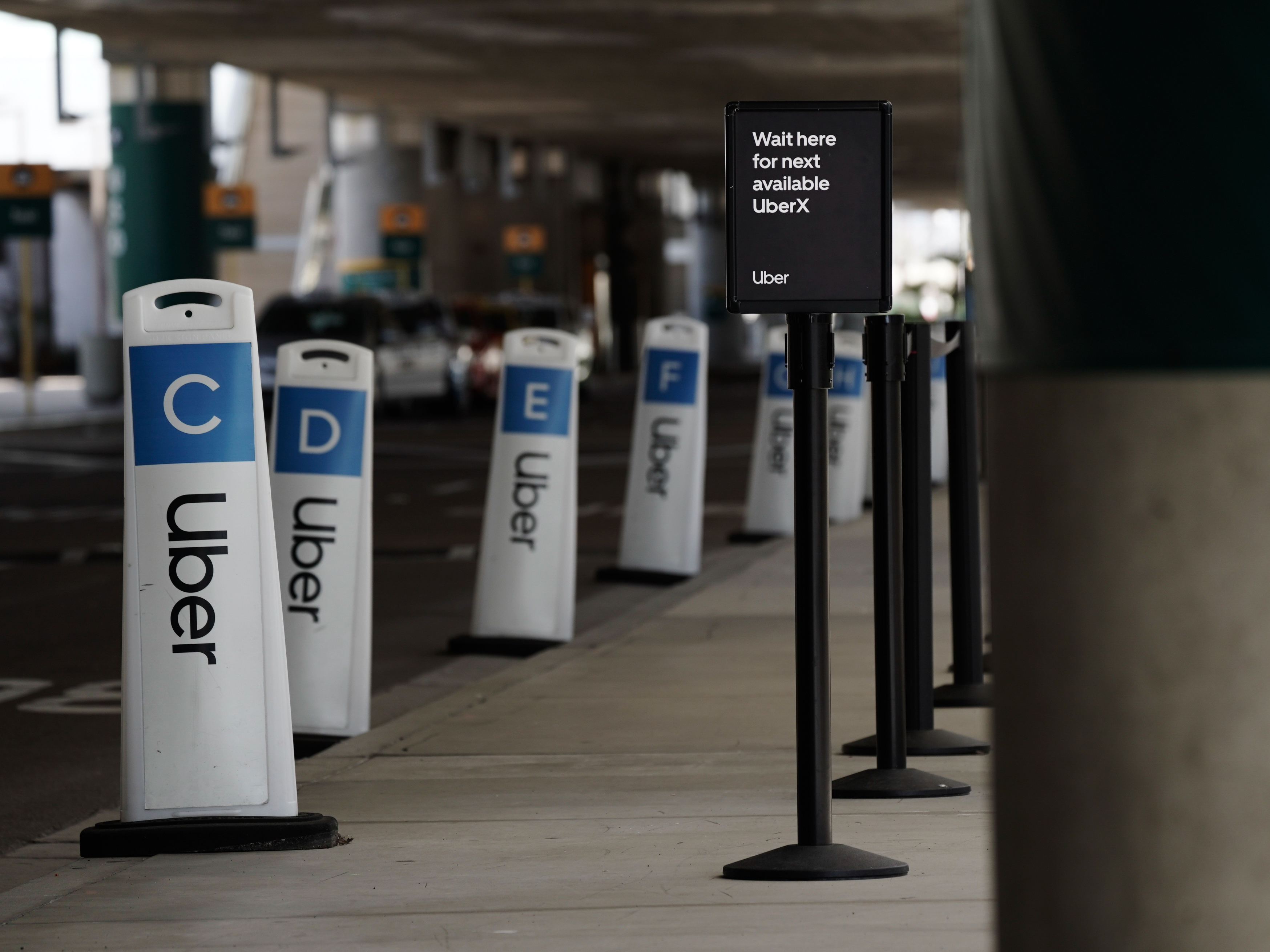 Millions of Uber drivers and other people who make a living from gig work are temporarily eligible for unemployment benefits. But the money has been slow to arrive. (Bloomberg via Getty Images)