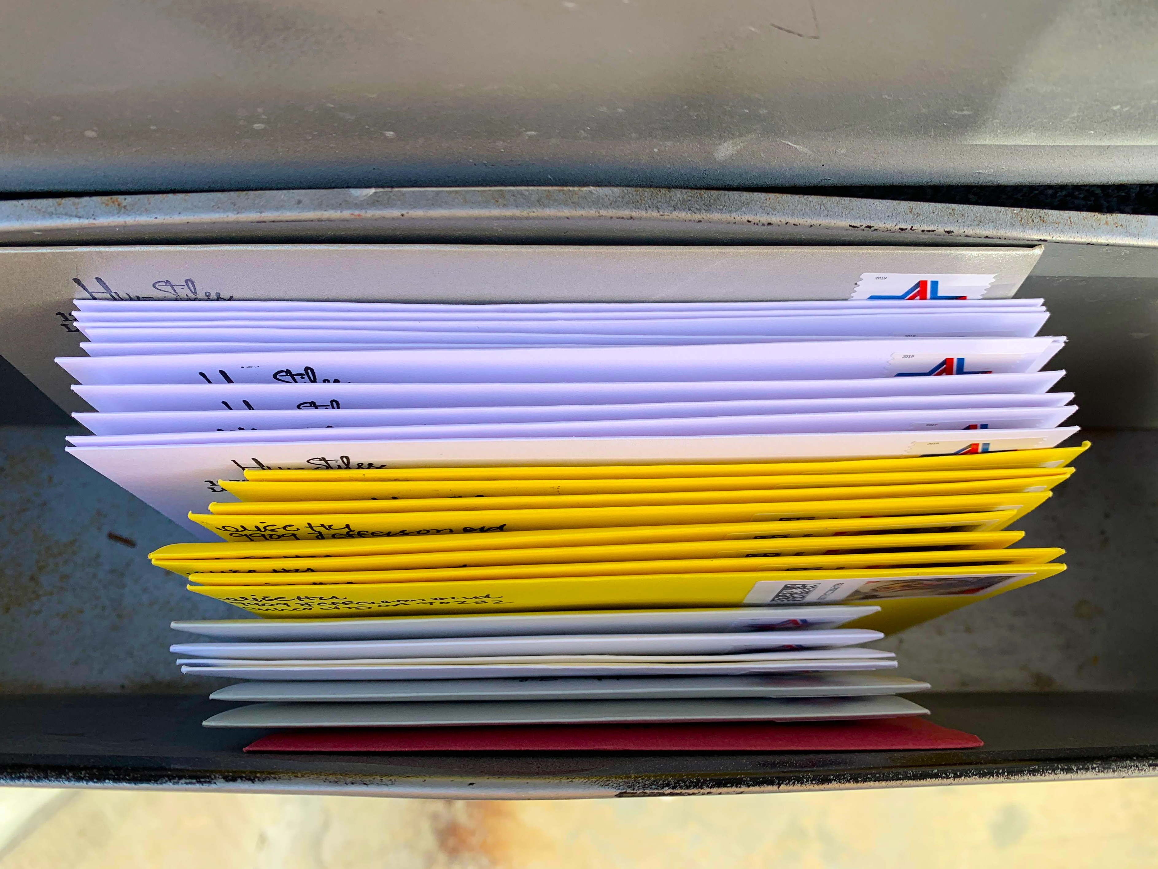 The first batch of handwritten cards and letters, awaiting USPS pickup in the mailbox. (NPR)