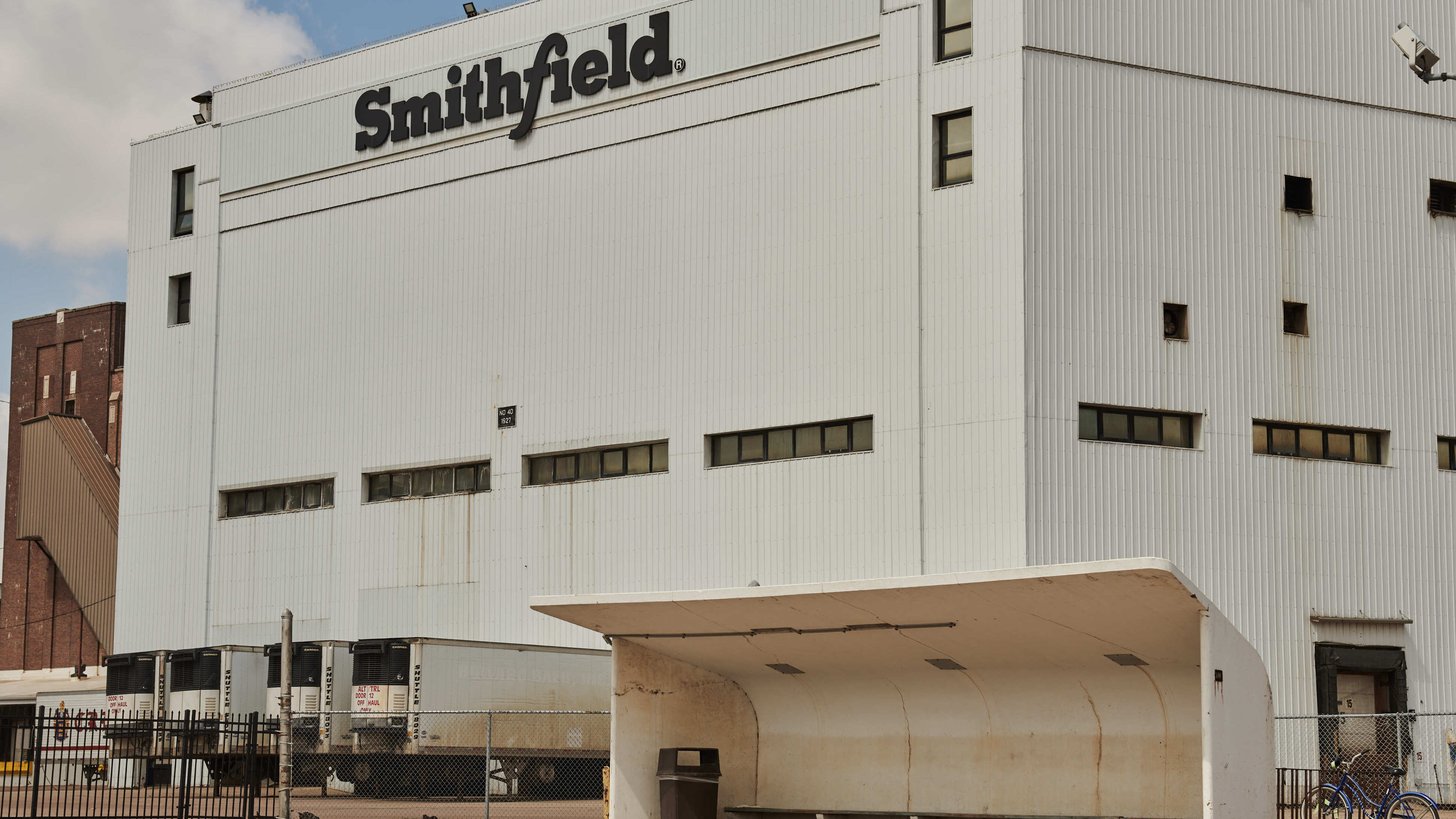 A bus stop stands empty in front of the closed Smithfield Foods Inc. plant in Sioux Falls, South Dakota, U.S., on Wednesday, April 15. (Bloomberg via Getty Images)