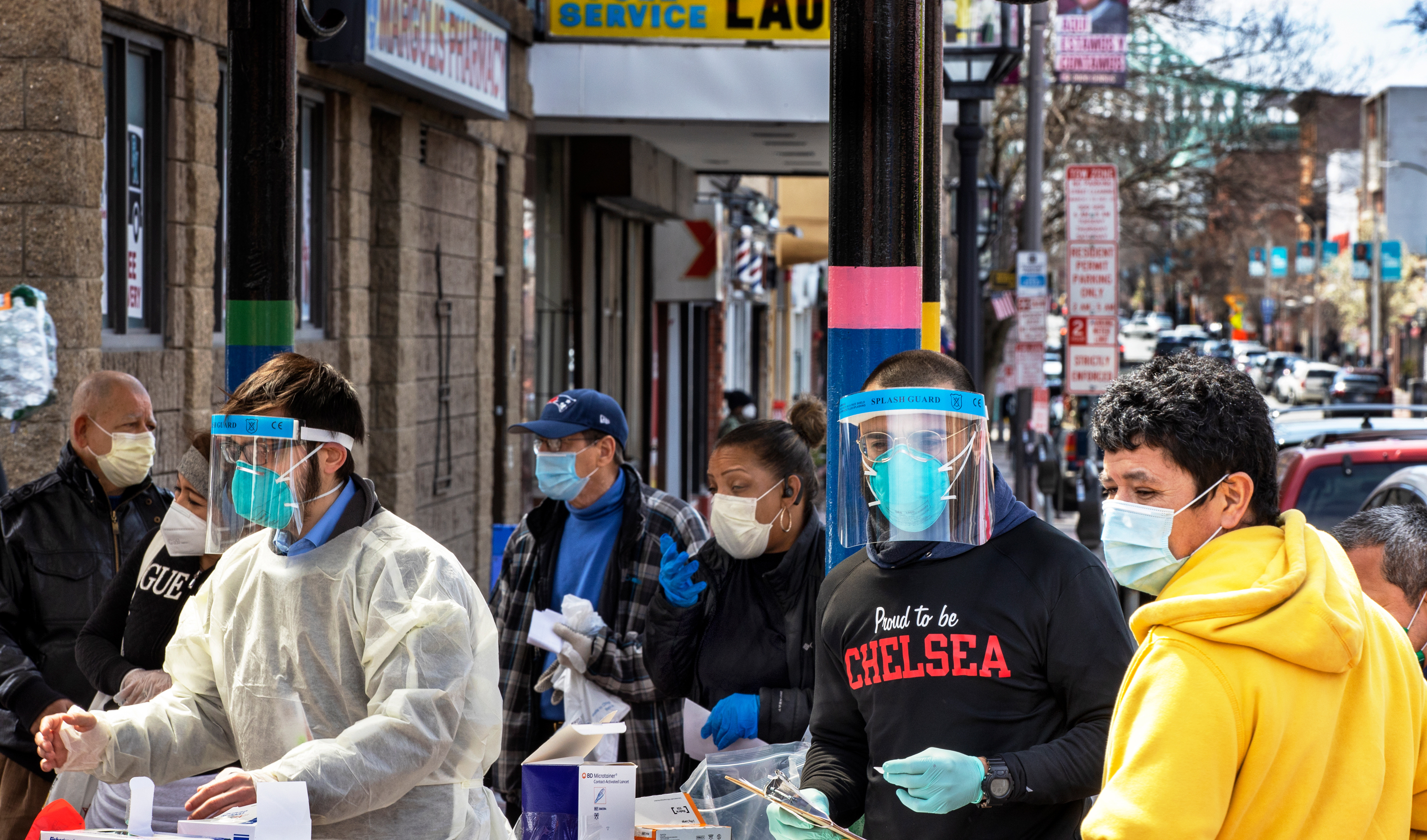 People line up in mid-April in Chelsea, Mass., to get antibody tests for the coronavirus that causes COVID-19. (The Boston Globe via Getty Images)