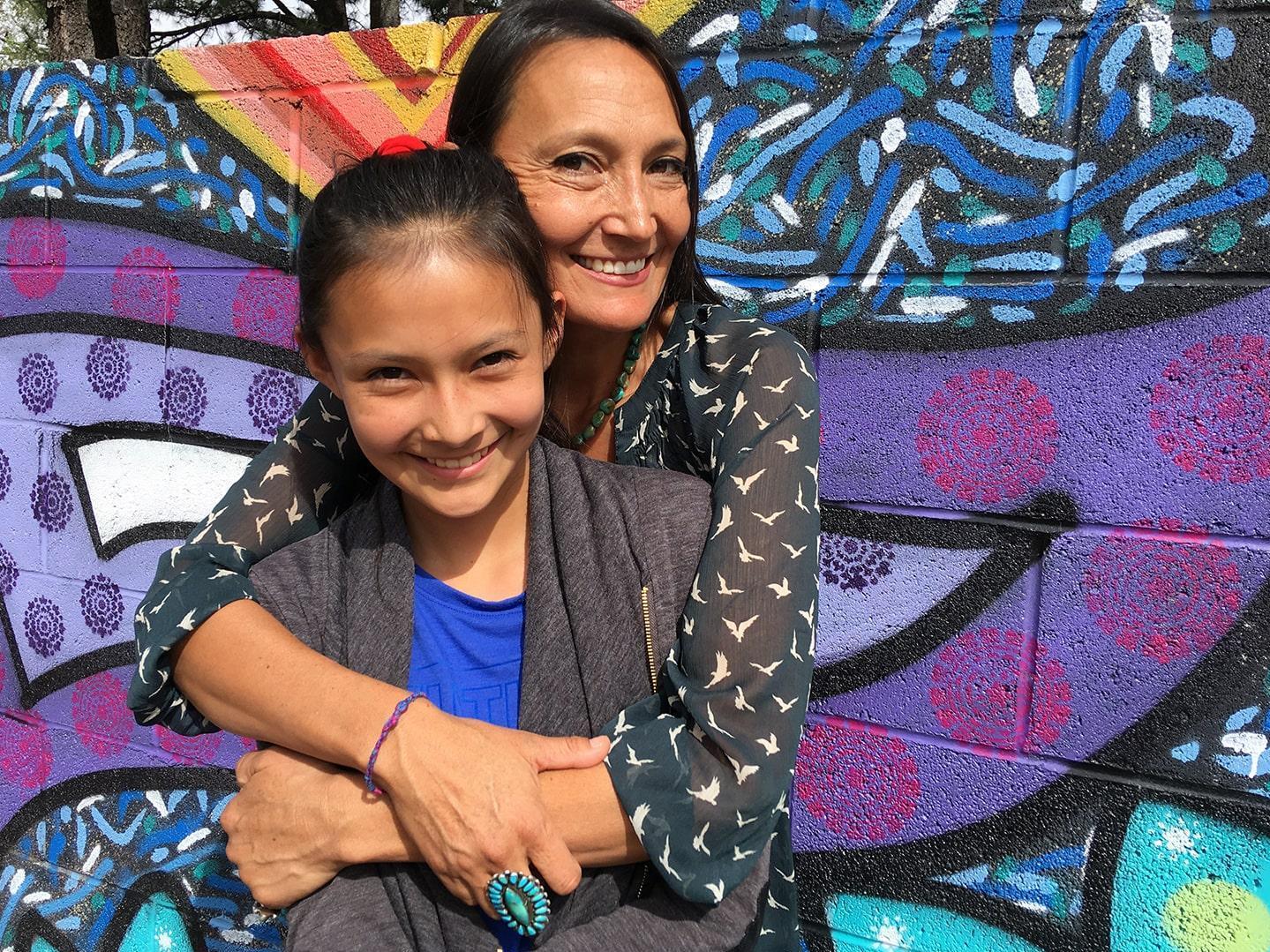 Traditional Diné medicine practitioner Jeneda Benally, pictured here with her daughter Dahi, is trying to preserve cultural wisdom in danger of being lost during the pandemic. (KJZZ)