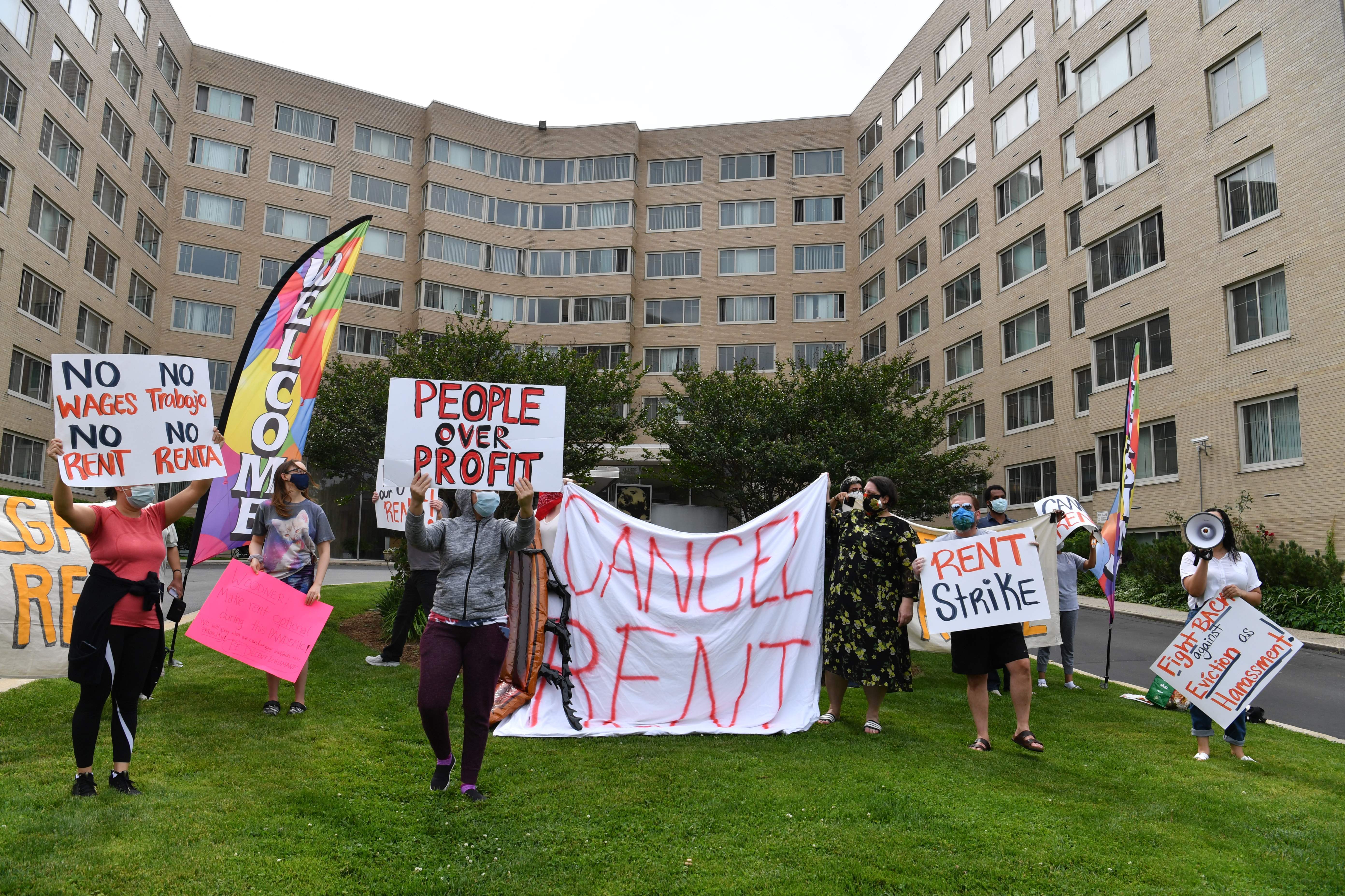 Renters in the Woodner apartment building in Washington, D.C., protest on May 28 to demand that their rent be forgiven during the COVID-19 pandemic. (AFP via Getty Images)
