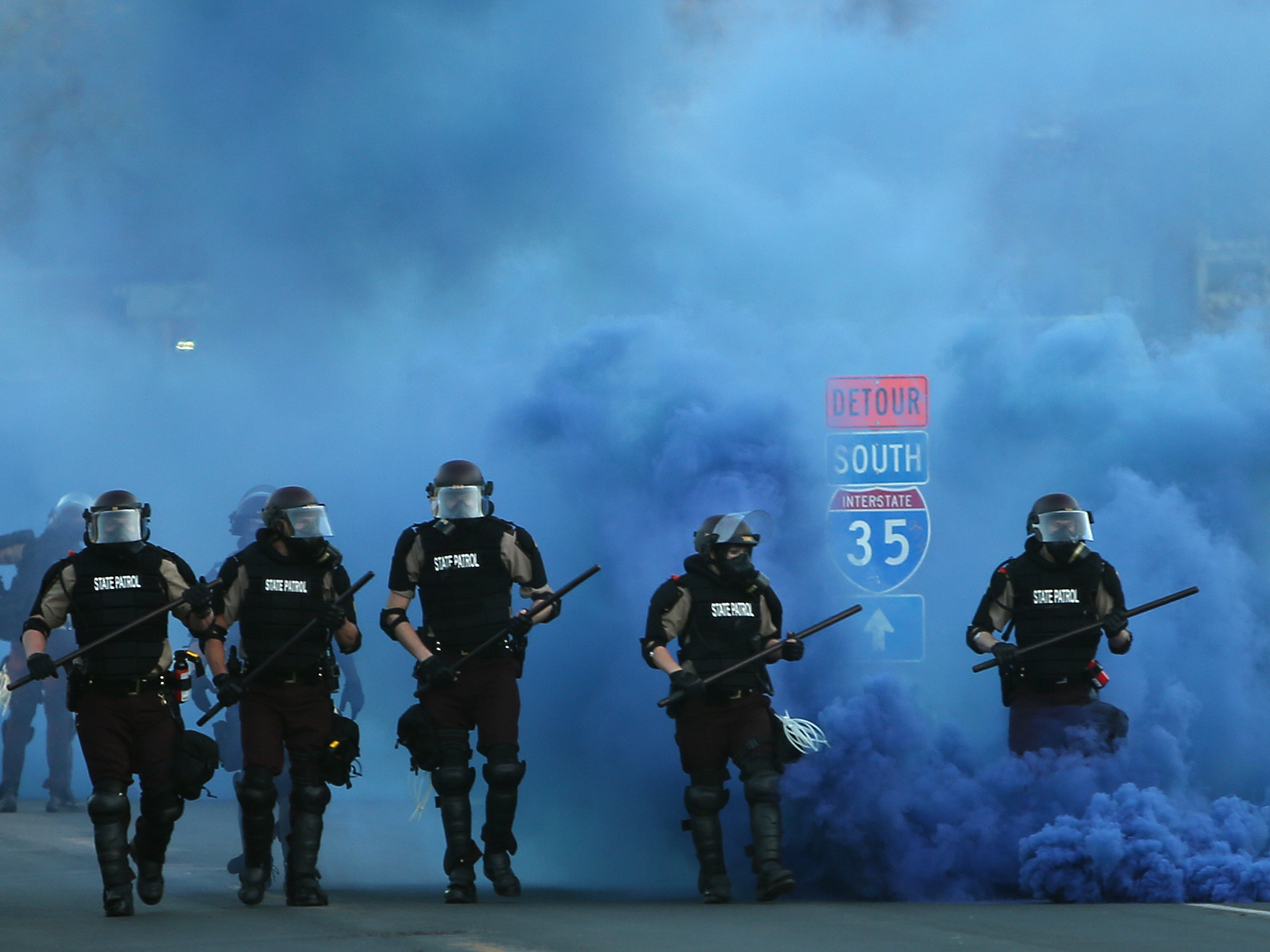 Police advance on demonstrators who are protesting the killing of George Floyd on Saturday in Minneapolis. (Getty Images)