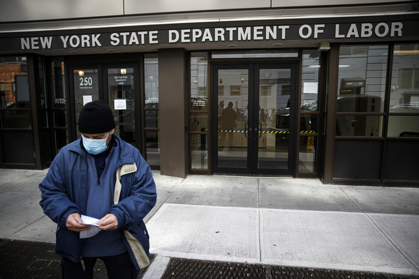 Visitors to the New York Department of Labor are turned away at the door by personnel because of closures over coronavirus concerns in New York on March 18. New York state began offering job protections for those required, or cautioned, to self-isolate or quarantine by a government entity.