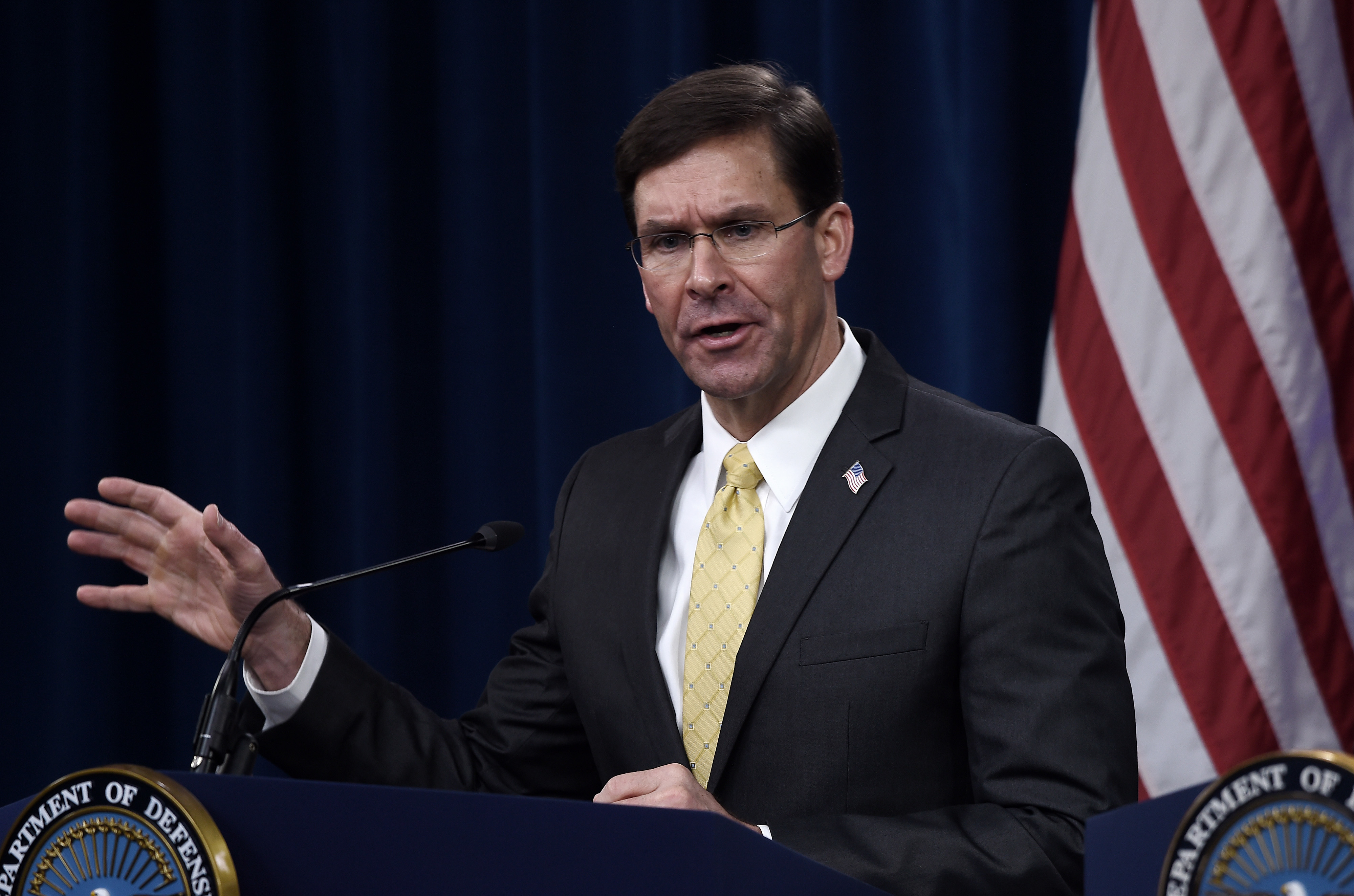 Defense Secretary Mark Esper, here at a Pentagon press conference in March, says he does not support invoking the 1807 Insurrection Act to deal with the current unrest in the nation. (AFP via Getty Images)