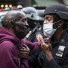 A protester and a police officer shake hands during a June 2 solidarity rally in New York calling for justice over the death of George Floyd, who died after being restrained by Minneapolis police officers on May 25.