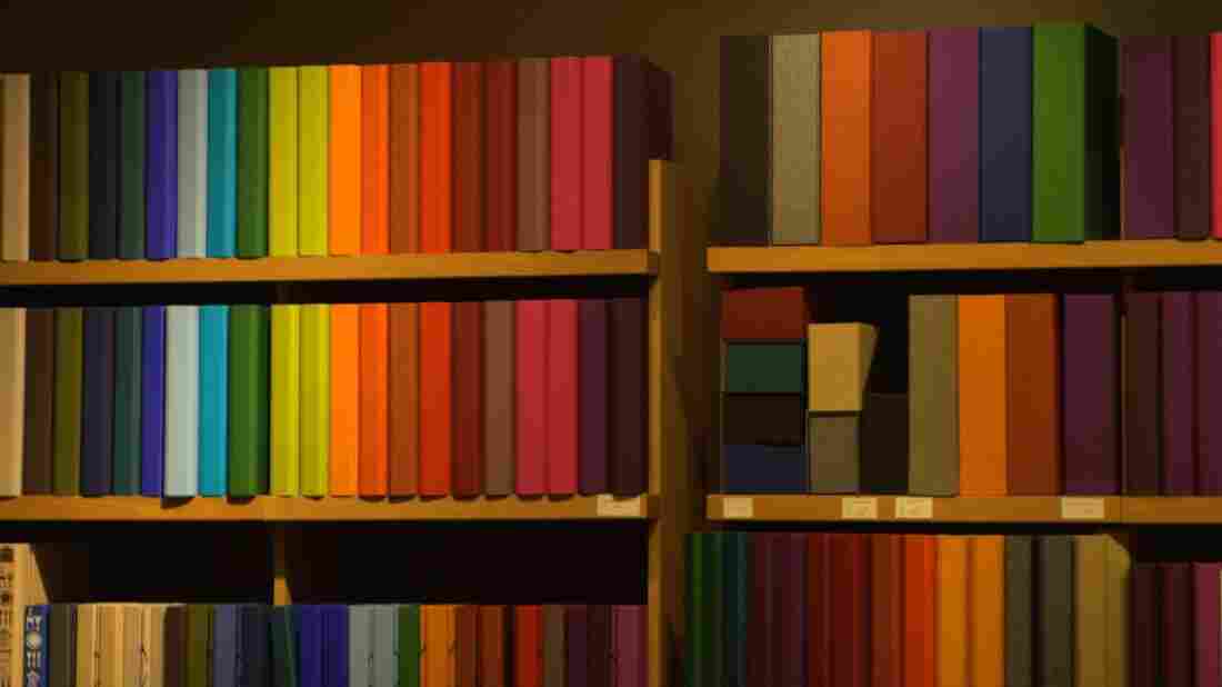 Image of a bookshelf with multi-colored books.