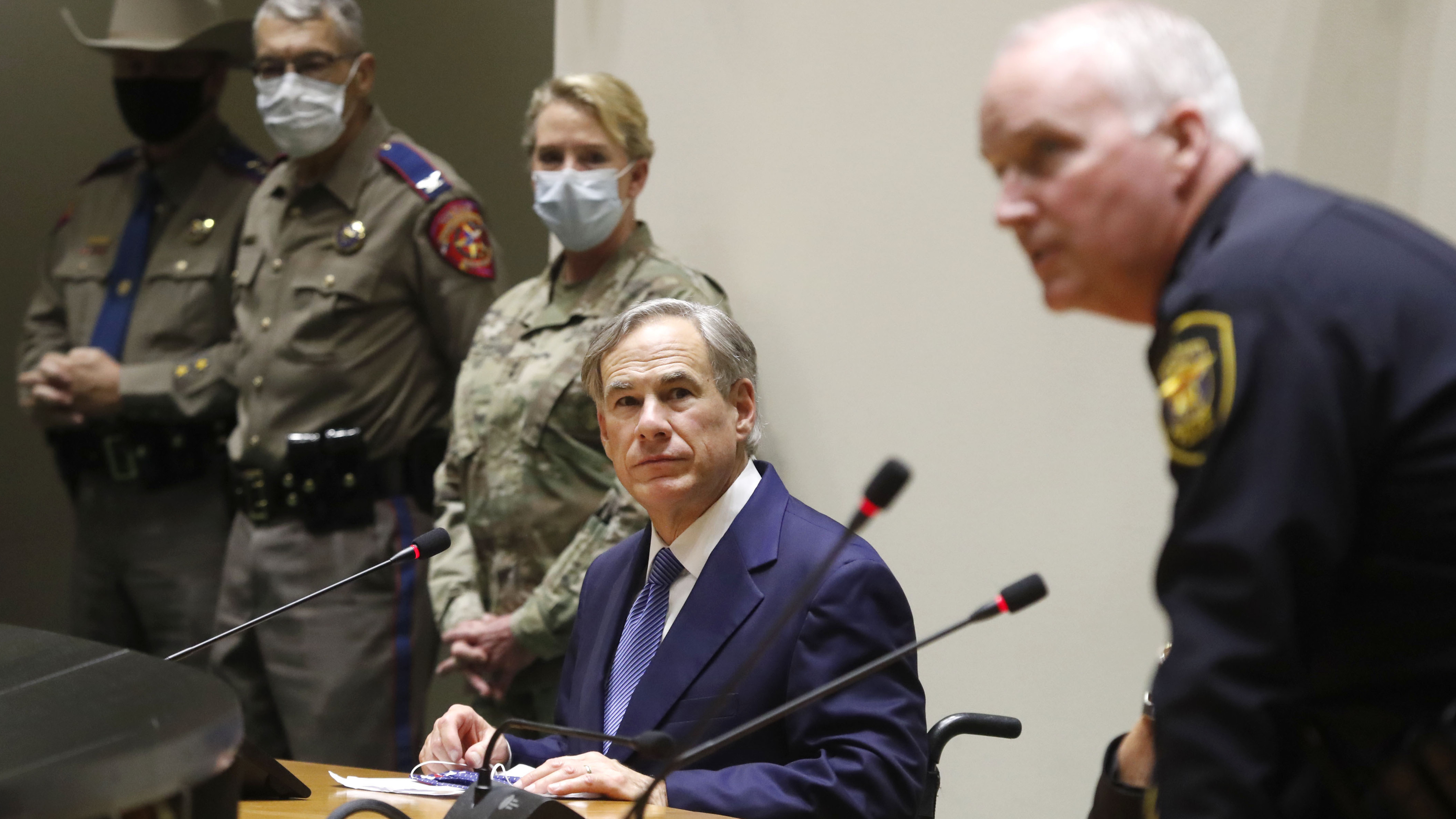 "The protestors have expressed their anger over police misconduct" — and his department will change how it operates, says Fort Worth Police Chief Ed Kraus (far right) seen here earlier this month at a briefing with Texas Gov. Greg Abbott.
