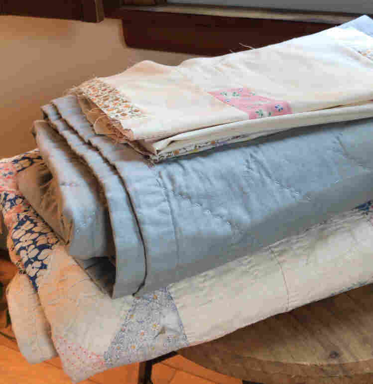 Emma's great-grandmother's handmade quilt, her own and early quilt pieces from her current work-in-progress.