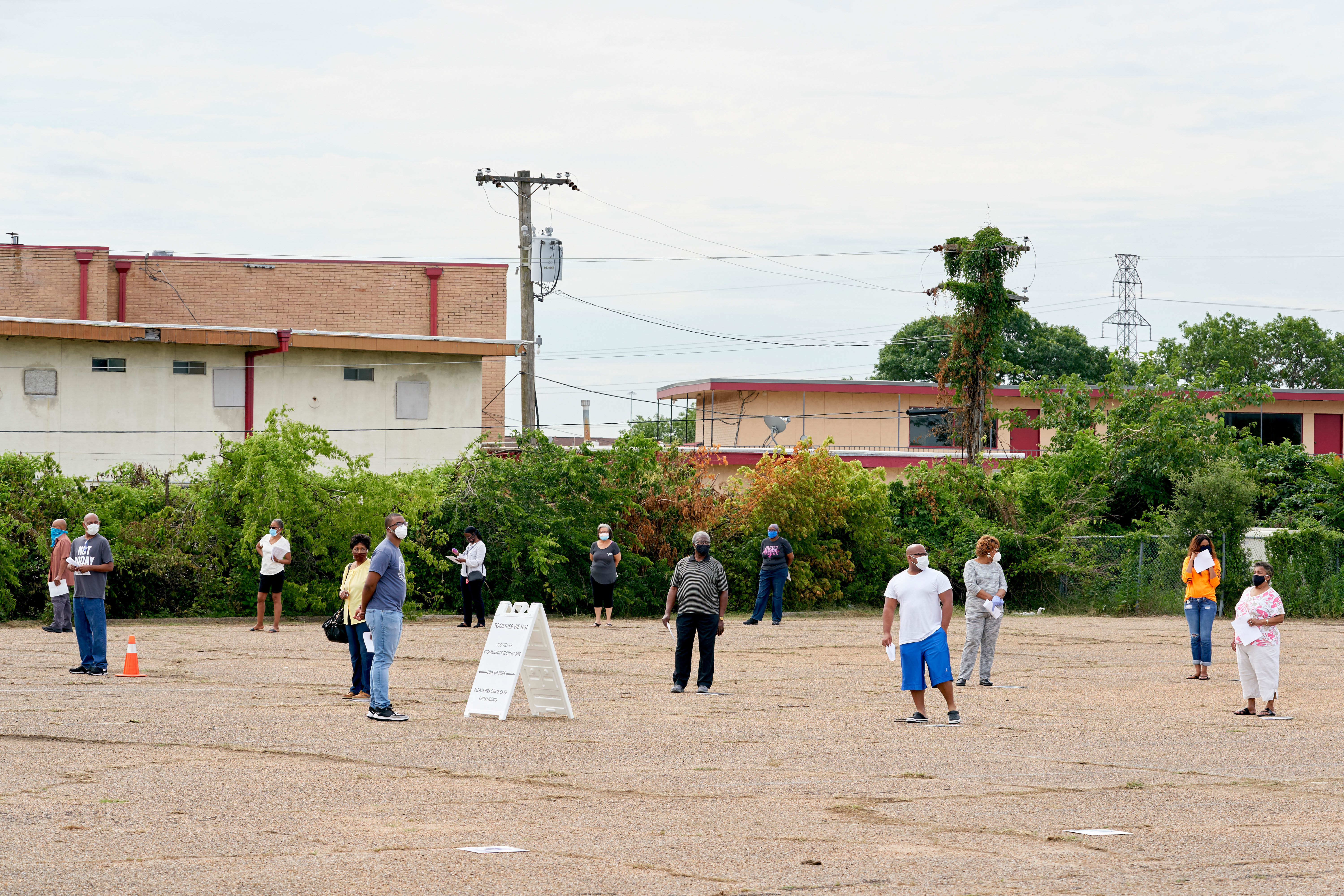 Visitors stand in line during Project Unity's &quot;Together We Test&quot; coronavirus testing at a  Friendship-West Baptist Church campus in South Dallas, Texas on May 28, 2020. (Cooper Neill for NPR)