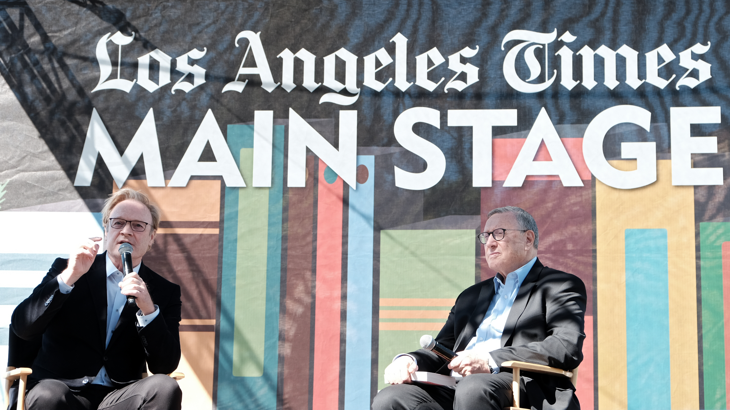 <em>LA Times</em> Executive Editor Norman Pearlstine (right) listens to Lawrence O'Donnell at the 2019 Los Angeles Times Festival of Books in April 2019. (Getty Images)