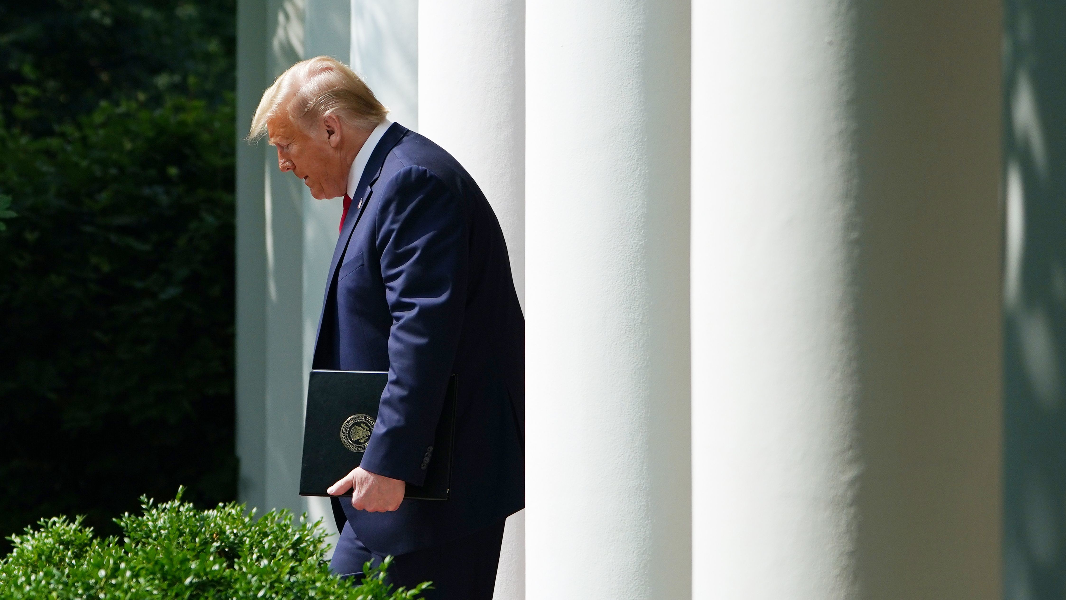 President Trump makes his way to the Rose Garden for a signing ceremony at the White House earlier this month.