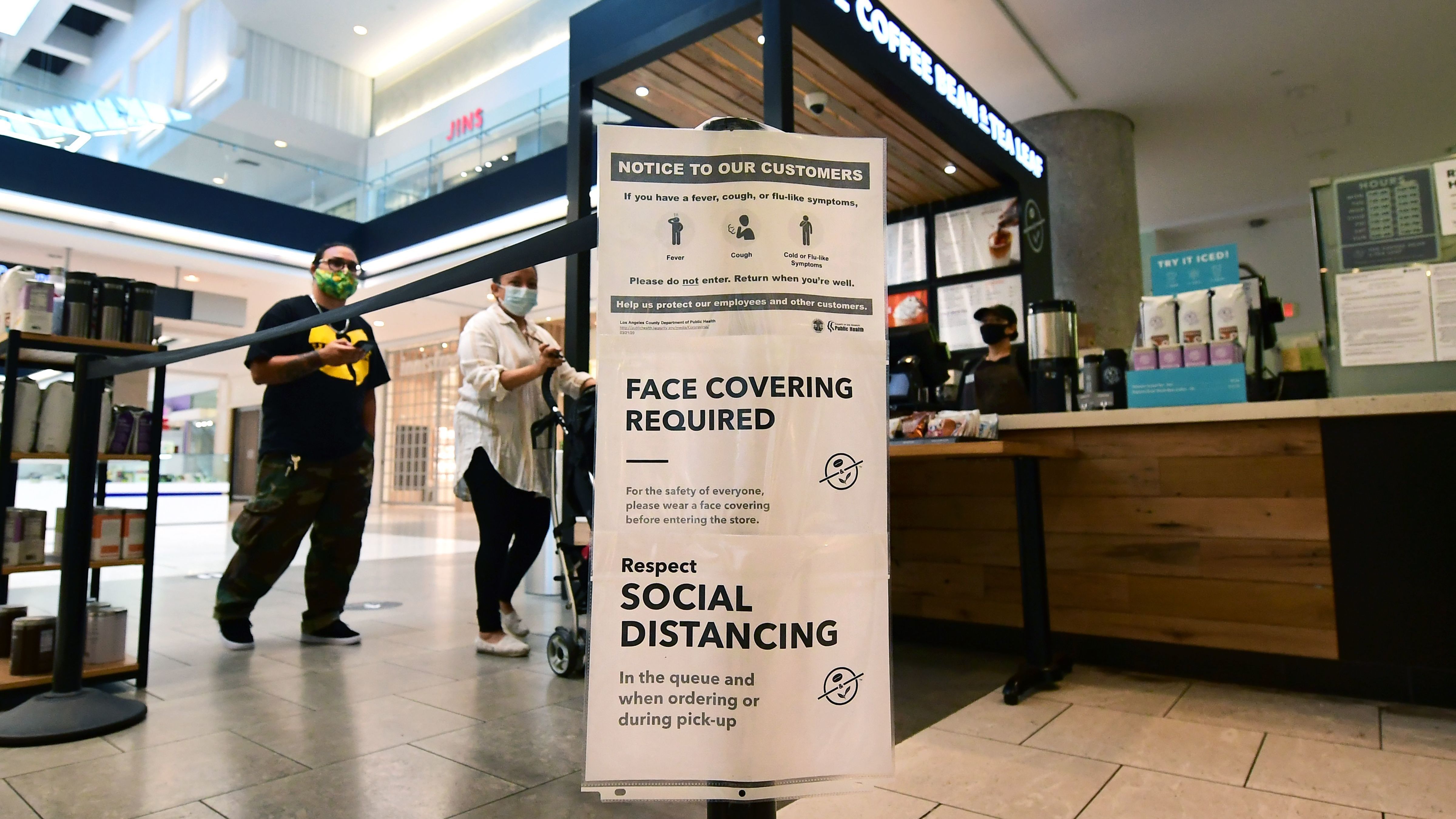 Social distancing instructions are posted at California's Westfield Santa Anita shopping mall on June 12, as local businesses enter Phase 3 reopening. (AFP/Getty Images)
