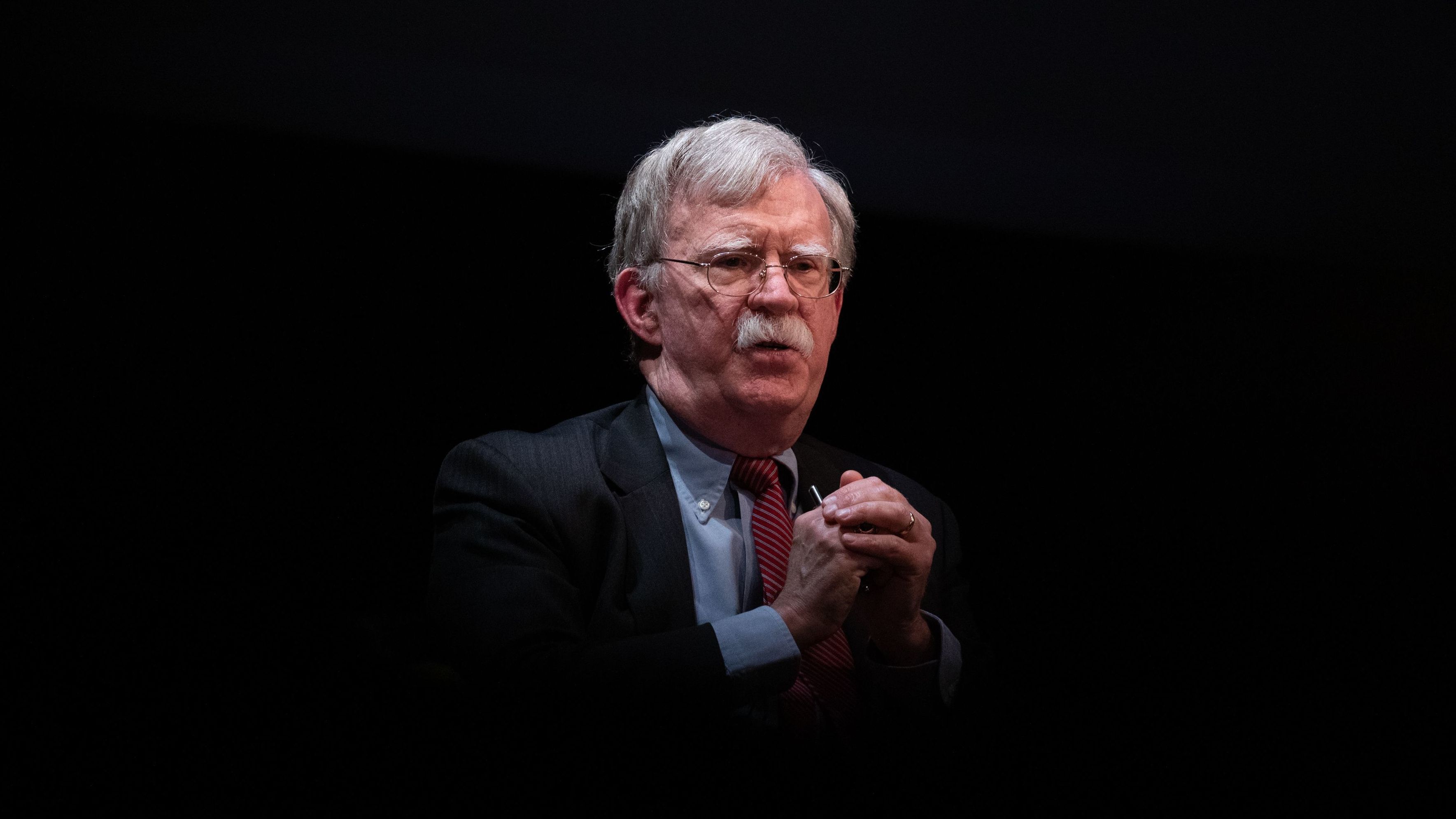 Former national security adviser John Bolton, here at a February event in North Carolina, is releasing a memoir with strong allegations of misconduct against President Trump. But Bolton's accusations are notable for the splash they aren't making. (AFP via Getty Images)