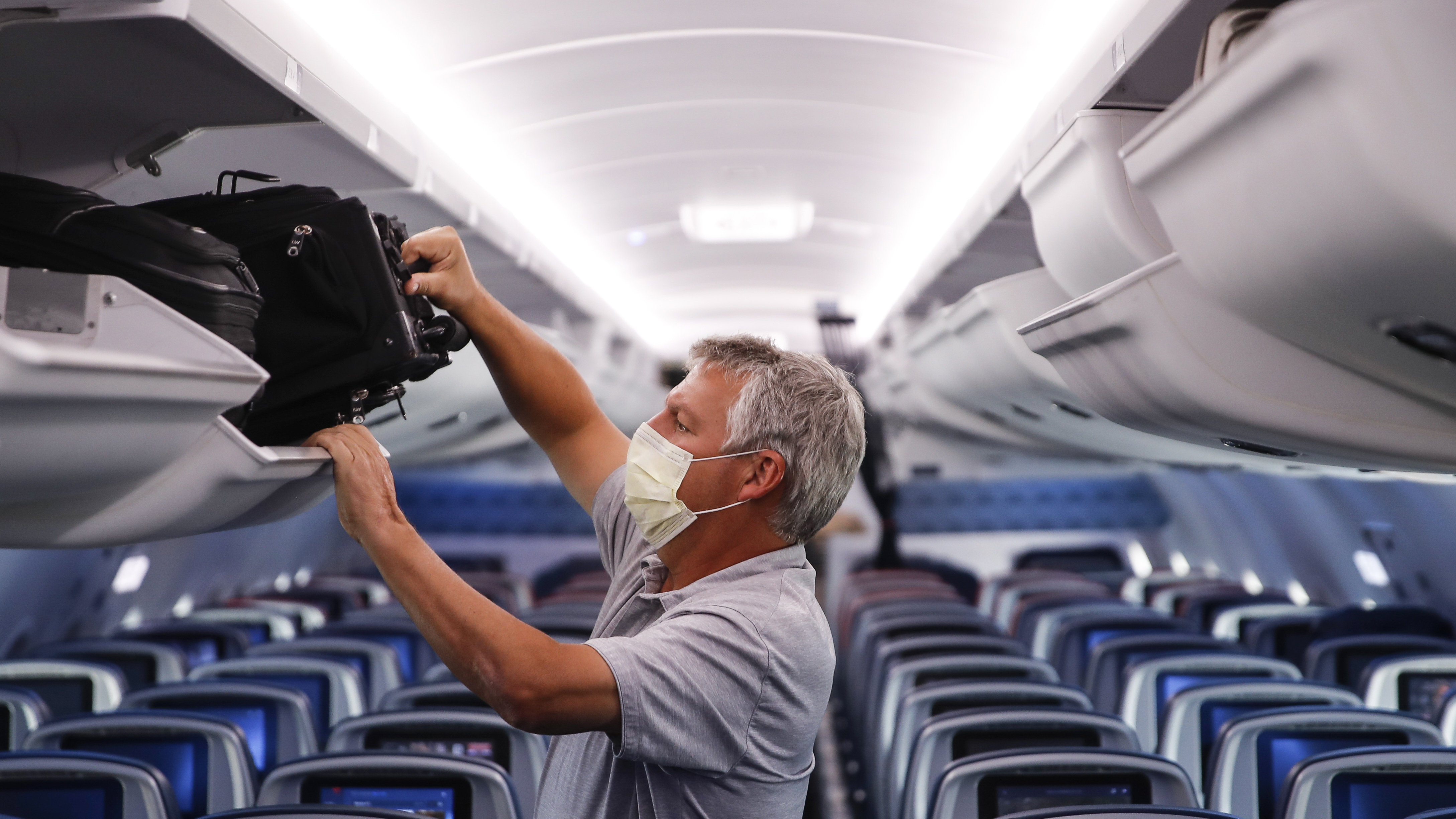 A passenger wore personal protective equipment on a Delta Air Lines flight after landing at Minneapolis−Saint Paul International Airport in late May.