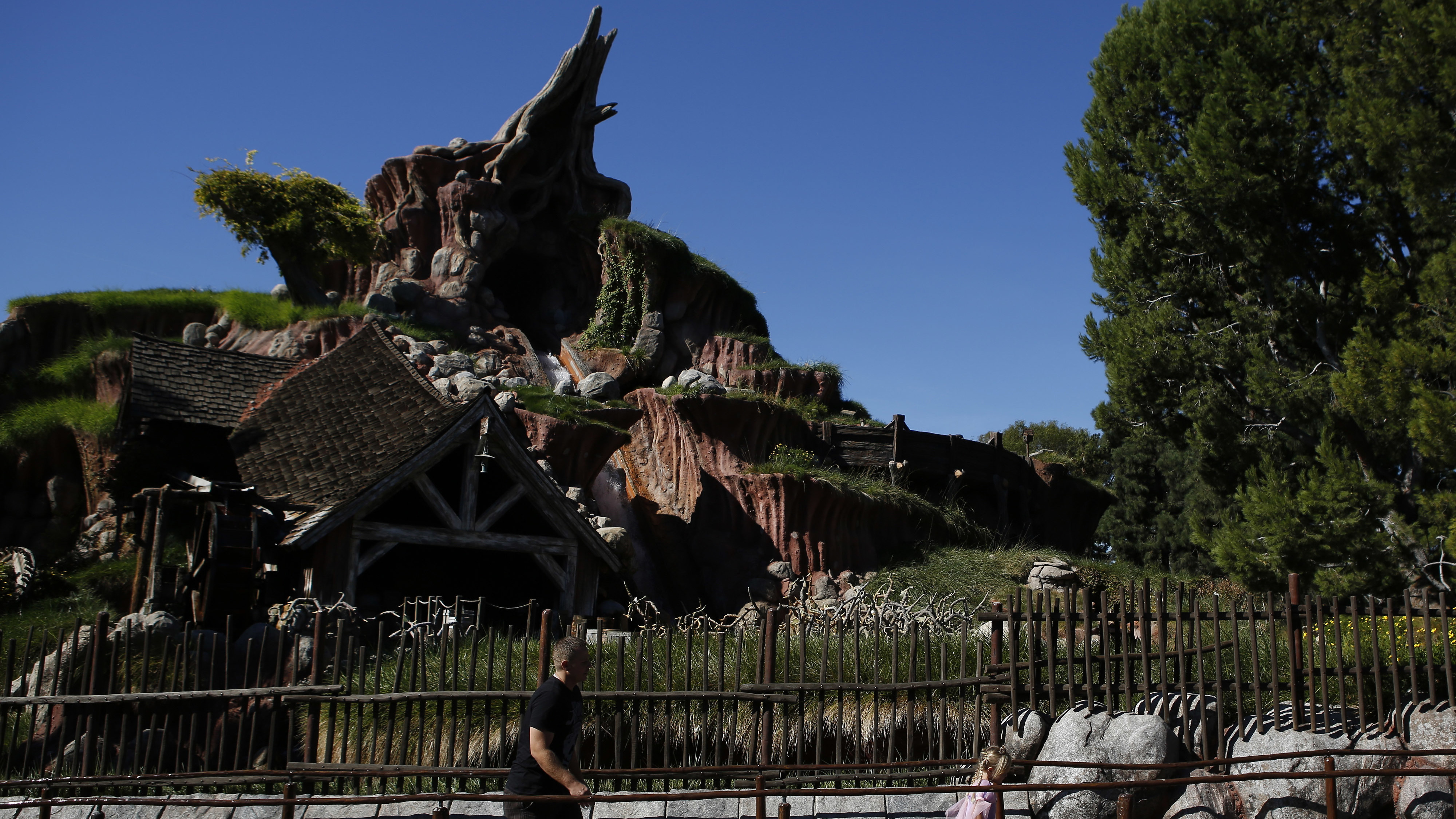 Guests walk in line to Splash Mountain at Disneyland in 2013.