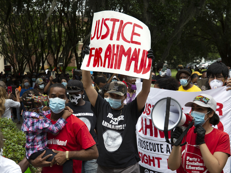 The death of Ahmaud Arbery, who was killed while jogging in February, prompted renewed calls for Georgia to pass a hate crimes law. Gov. Brian Kemp signed House Bill 426 on Friday, giving the state its first hate crime law in 16 years. (Stephen B. Morton/AP)