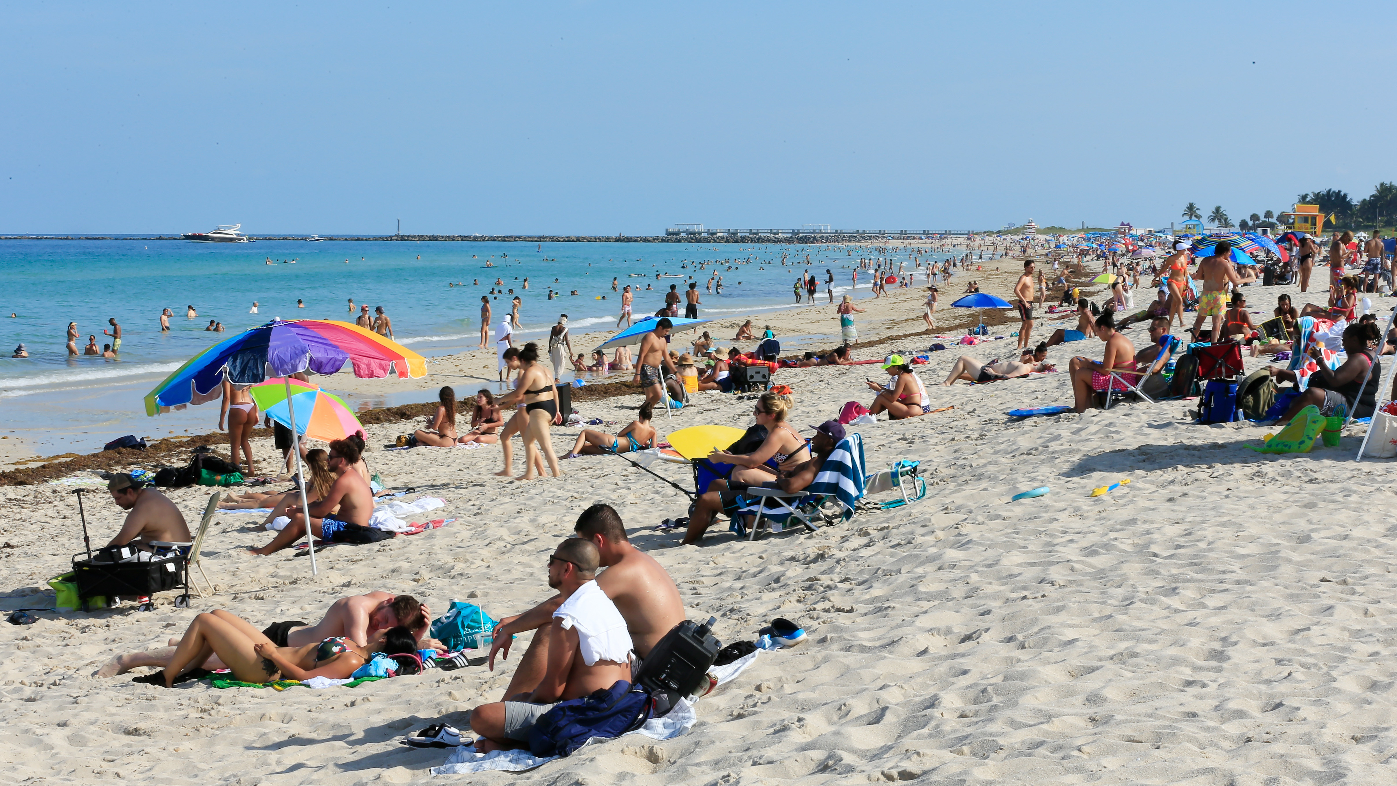 Beachgoers take advantage of the opening of South Beach on June 10, 2020 in Miami Beach, Florida after officials eased restrictions put in place to contain COVID-19. (Getty Images)